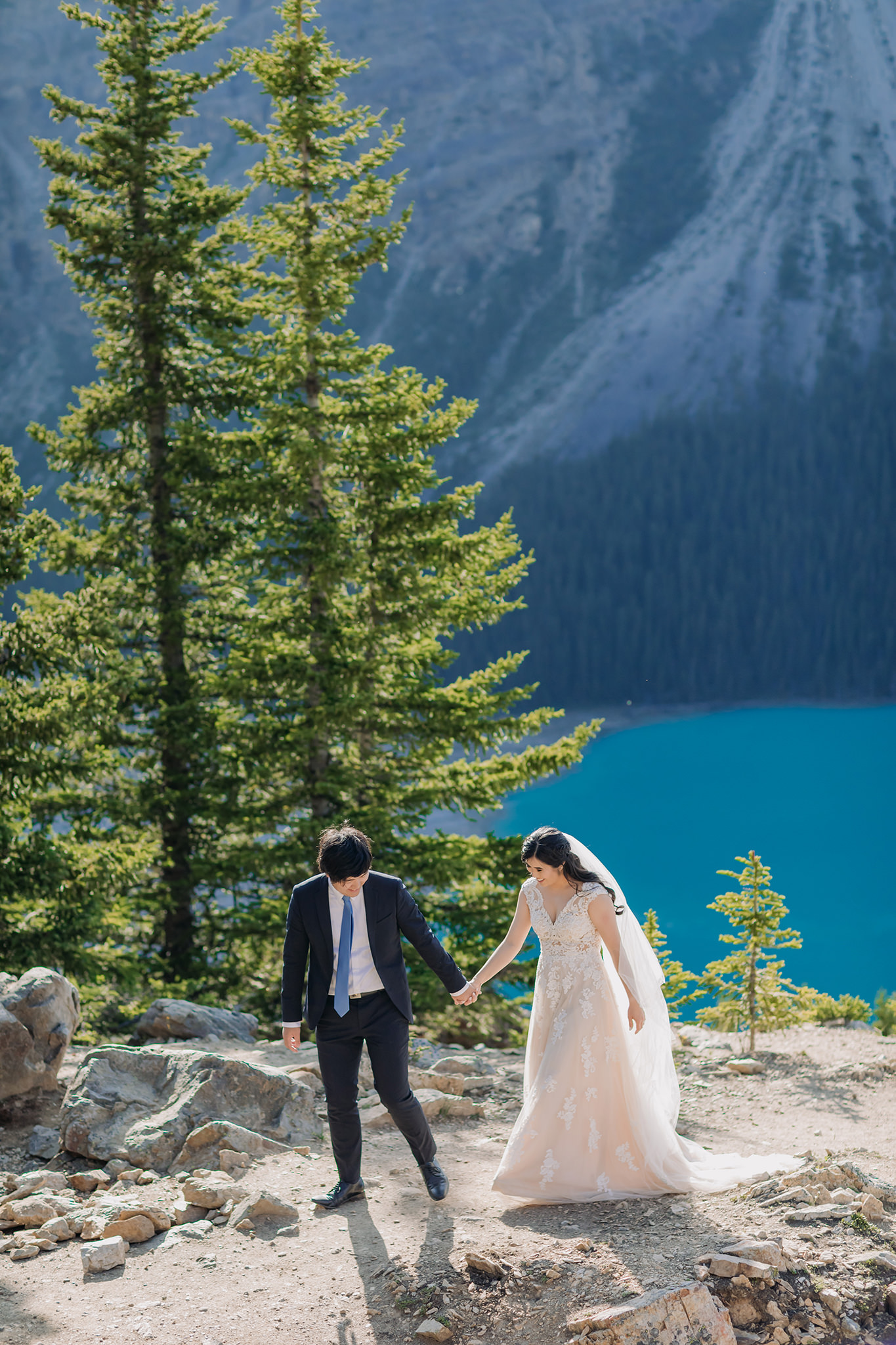Rocky Mountain wedding tour bride groom portraits at Peyto Lake viewpoint in the evening in Banff National Park photographed by mountain elopement specialist ENV Photography
