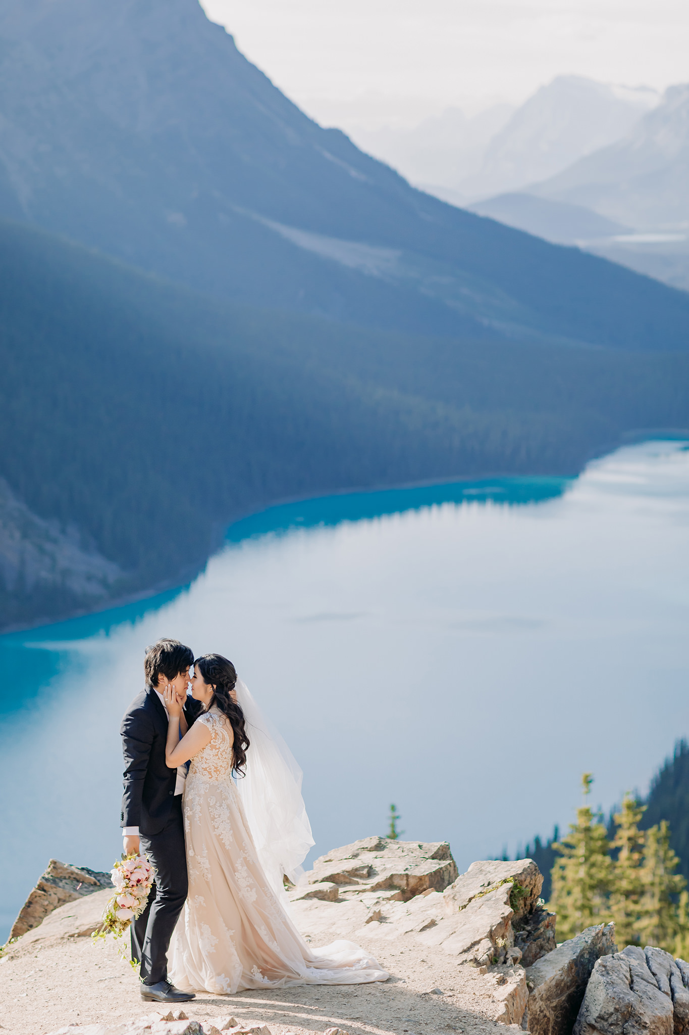 Rocky Mountain wedding tour bride groom portraits at Peyto Lake viewpoint in the evening in Banff National Park photographed by mountain elopement specialist ENV Photography