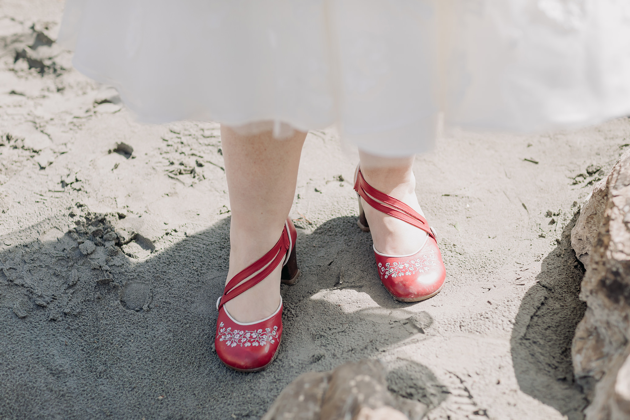 bride wearing red fluevog shoes on her wedding day at Emerald Lake Lodge