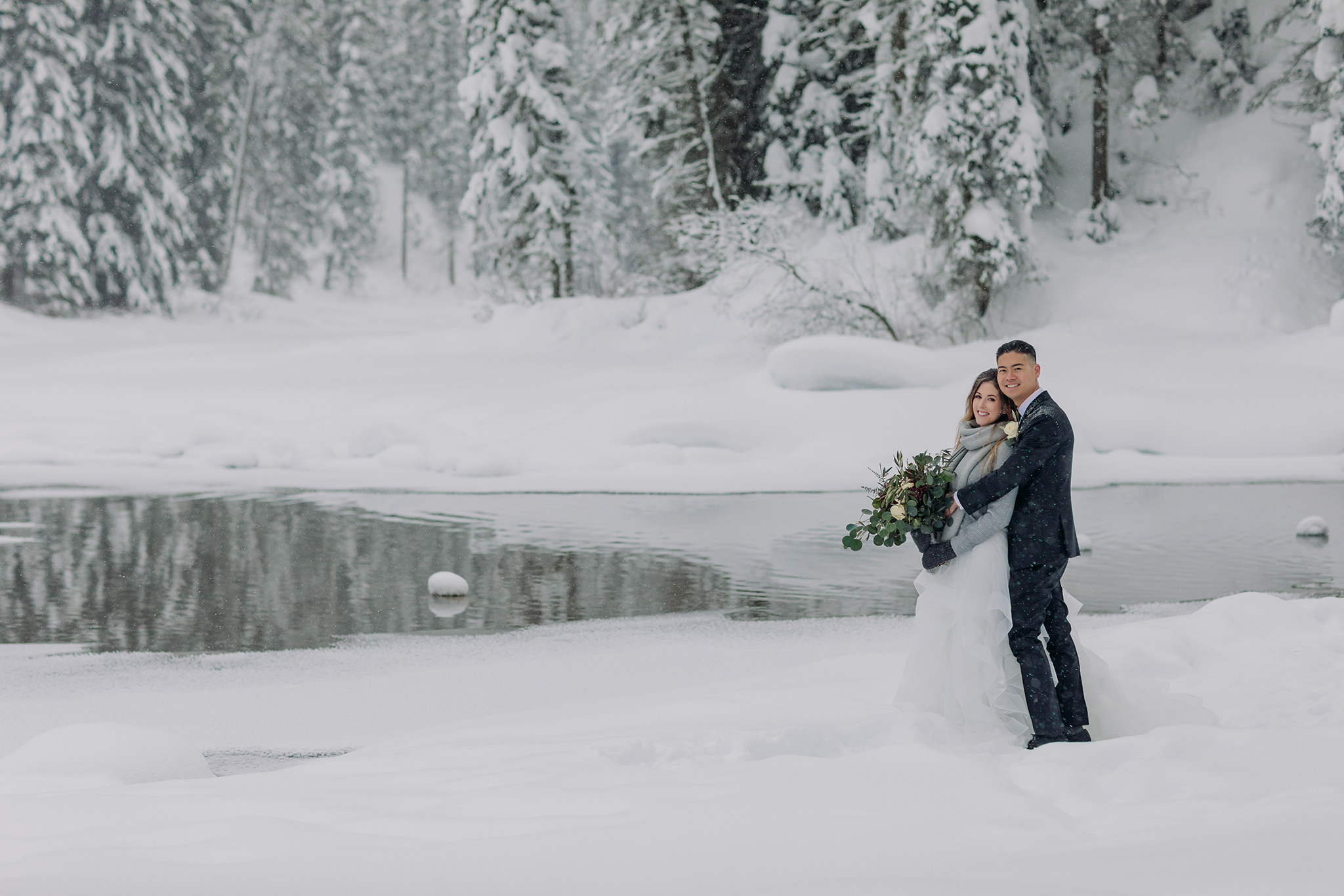 Snowy winter elopement at Emerald Lake Lodge in Yoho National Park. Mountain wedding in a winter wonderland. Bride in a cozy sweater & matching scarf to keep warm. What to wear for a winter wedding. 