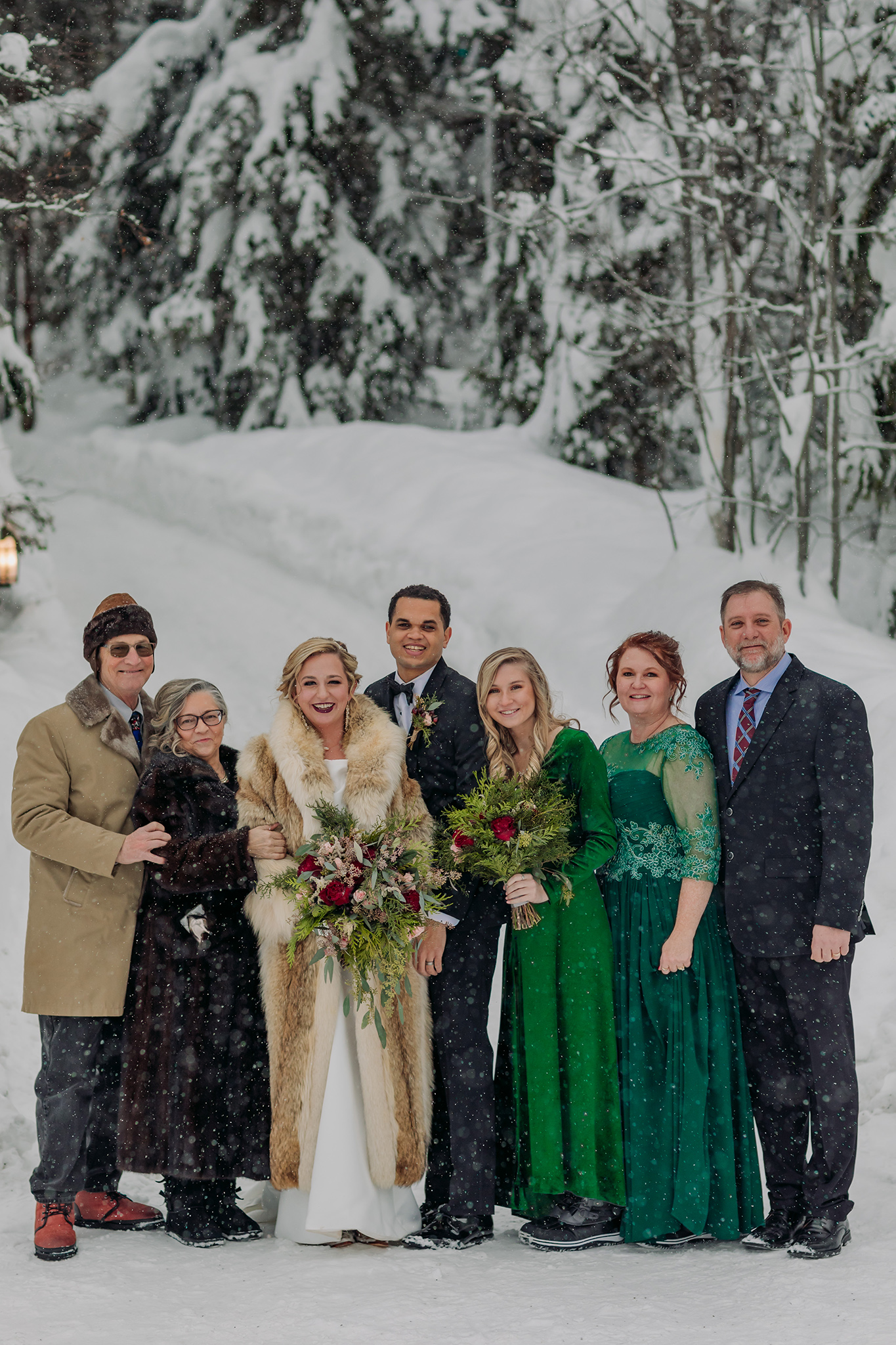 Emerald Lake Lodge outdoor winter wedding family photos in a real life snowglobe photographed by mountain elopement photographer ENV Photography