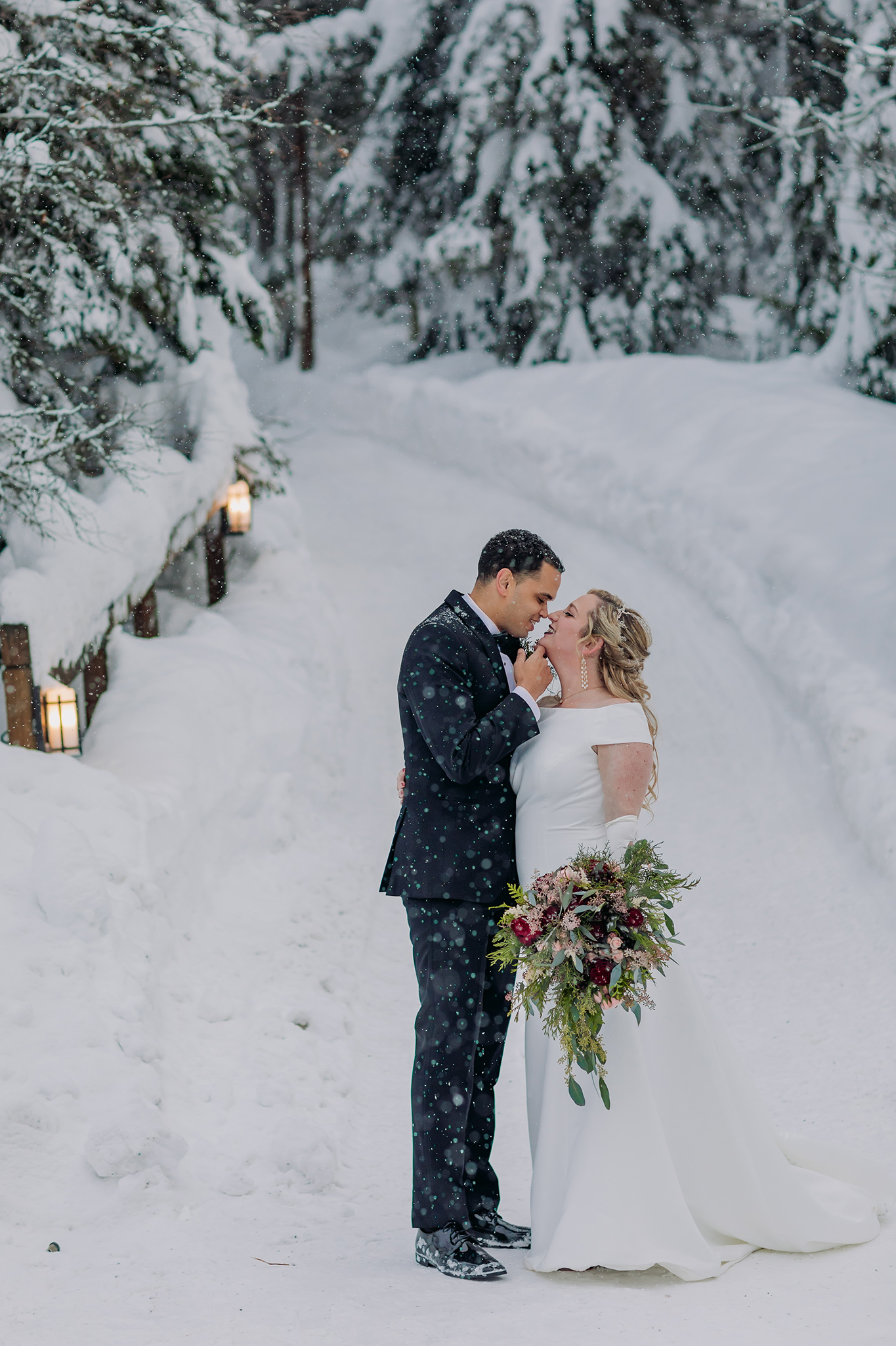 Emerald Lake Lodge outdoor winter wedding bride & groom portraits in a real life snow globe photographed by mountain elopement photographer ENV Photography