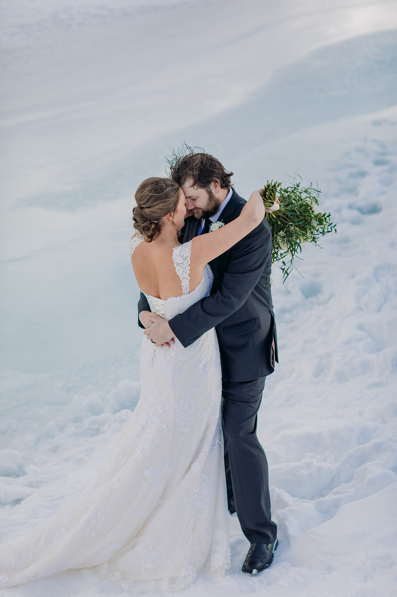 Lake Minnewanka bride & groom portraits Winter mountain wedding photos by Banff Wedding Photographer ENV Photography