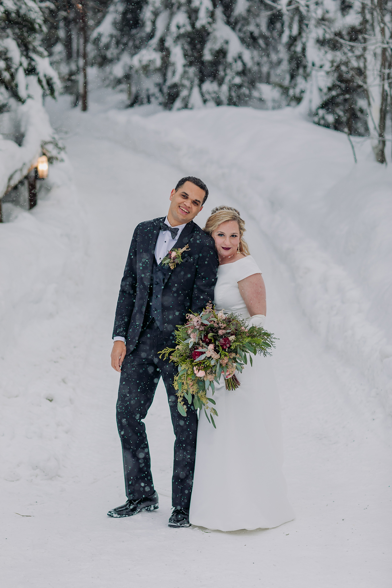 Emerald Lake Lodge outdoor winter wedding bride & groom portraits in a real life snowglobe photographed by mountain elopement photographer ENV Photography