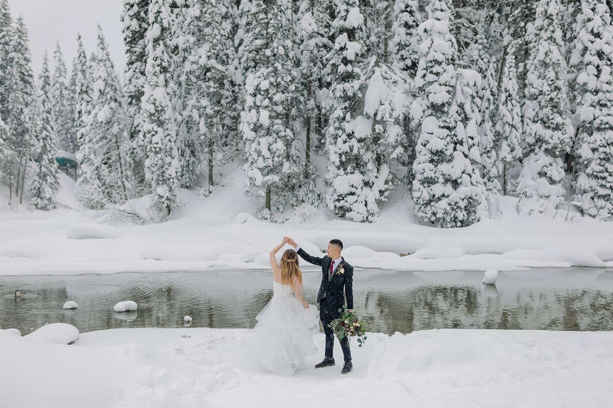Wedding portraits at Emerald Lake Lodge in Yoho National Park. Mountain wedding in a winter wonderland. 