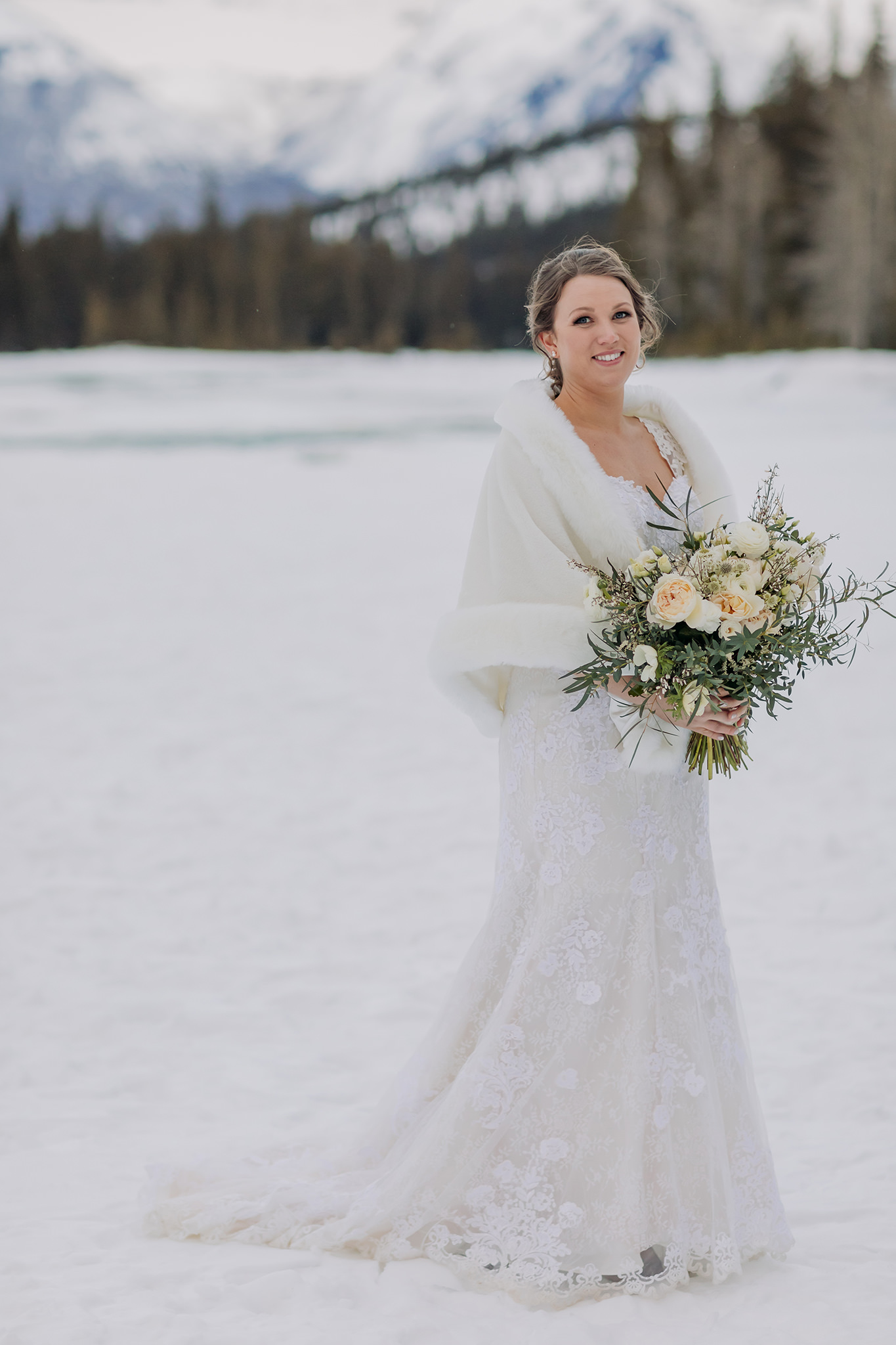 winter bridal portrait at bow falls in banff