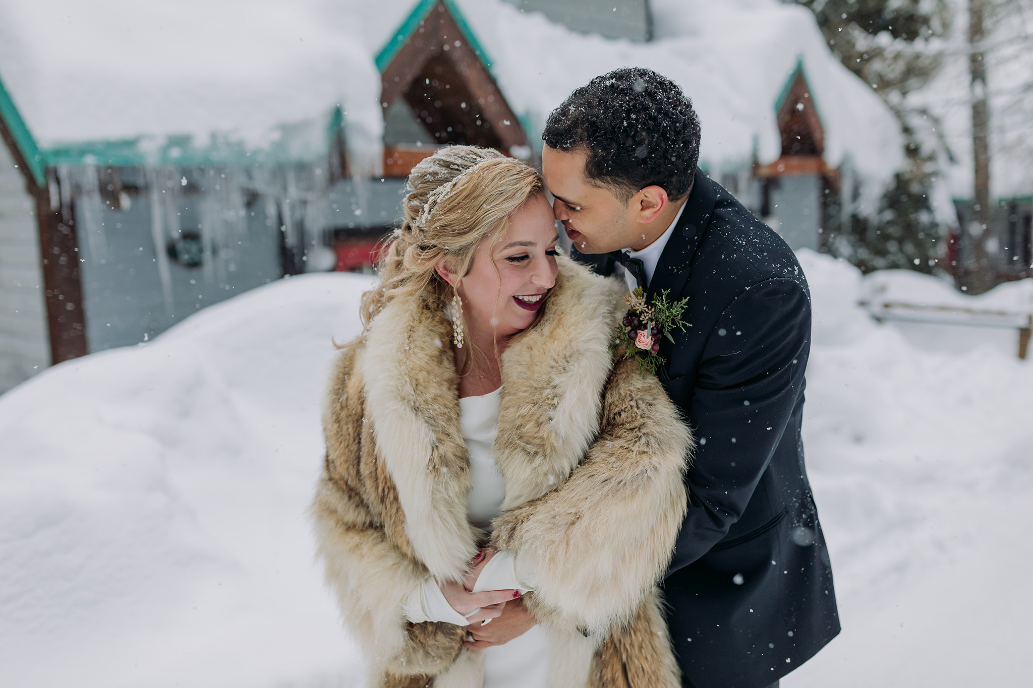 Emerald Lake Lodge outdoor winter wedding bride & groom portraits in a real life snow globe photographed by mountain elopement photographer ENV Photography