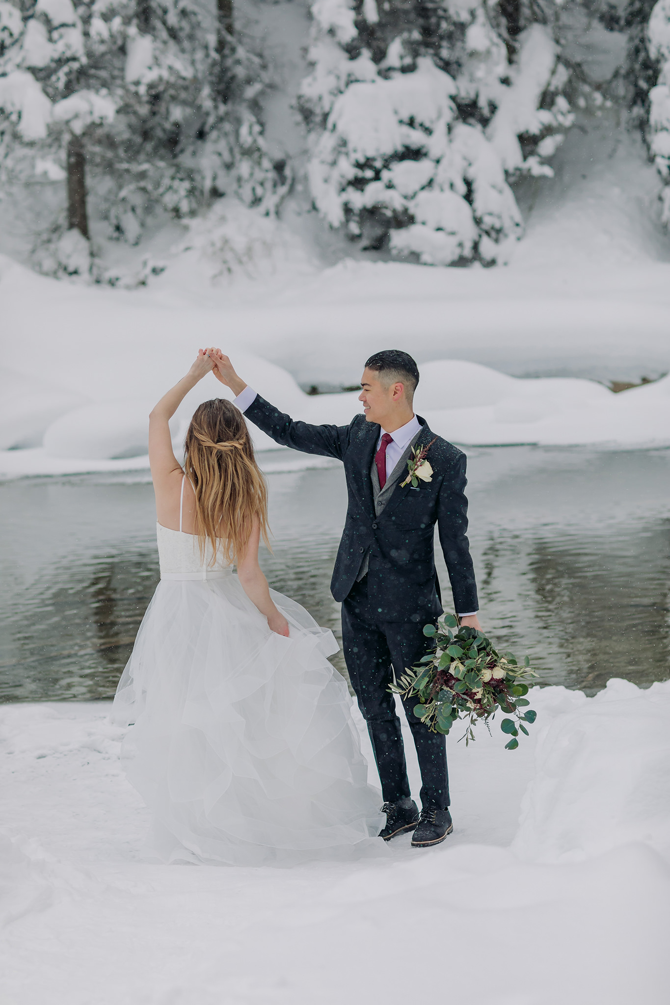 Wedding portraits at Emerald Lake Lodge in Yoho National Park. Mountain wedding in a winter wonderland. 