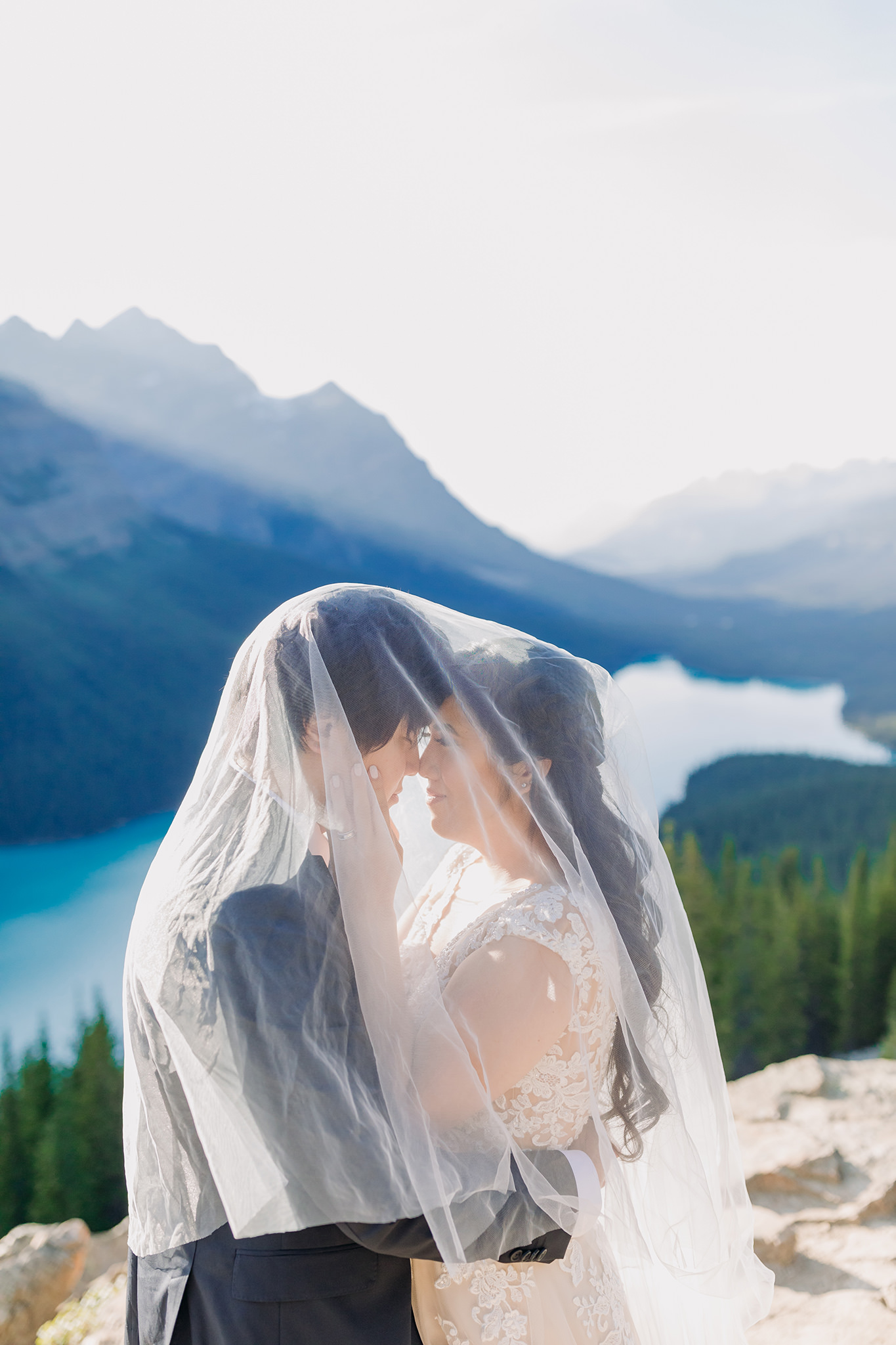 under veil bride groom portraits at Peyto Lake viewpoint in the evening in Banff National Park photographed by mountain elopement specialist ENV Photography