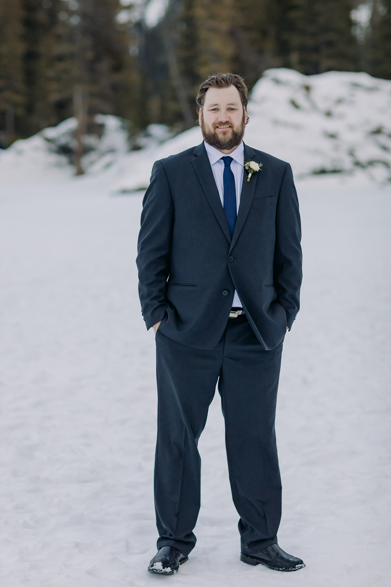 groom portraits at bow falls in banff