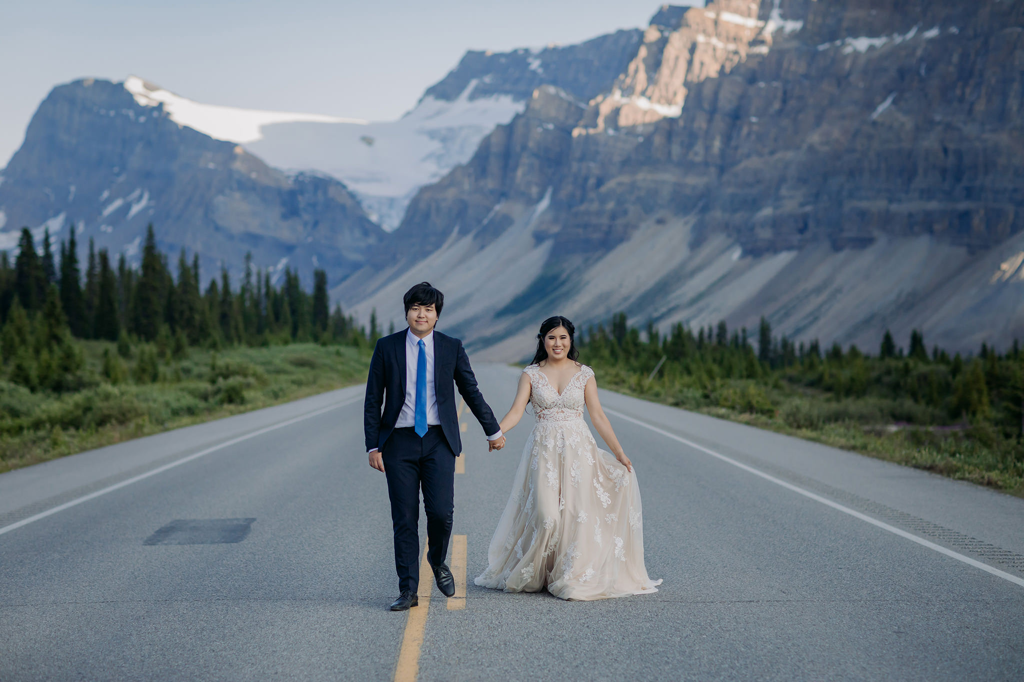 Rocky Mountain wedding tour bride groom portraits at Bow Lake on Icefields near sunset in Banff National Park photographed by mountain elopement specialist ENV Photography