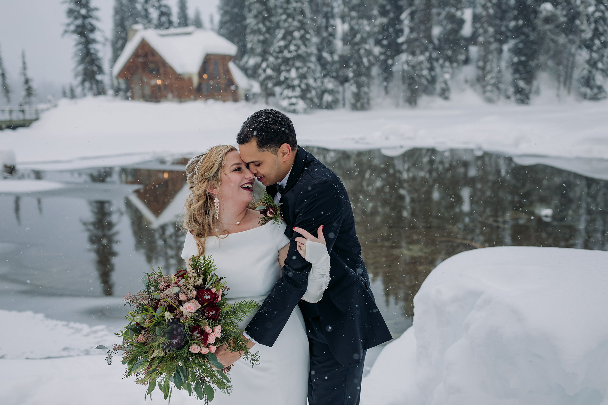 Emerald Lake Lodge outdoor winter wedding bride & groom portraits in a real life snowglobe photographed by mountain elopement photographer ENV Photography