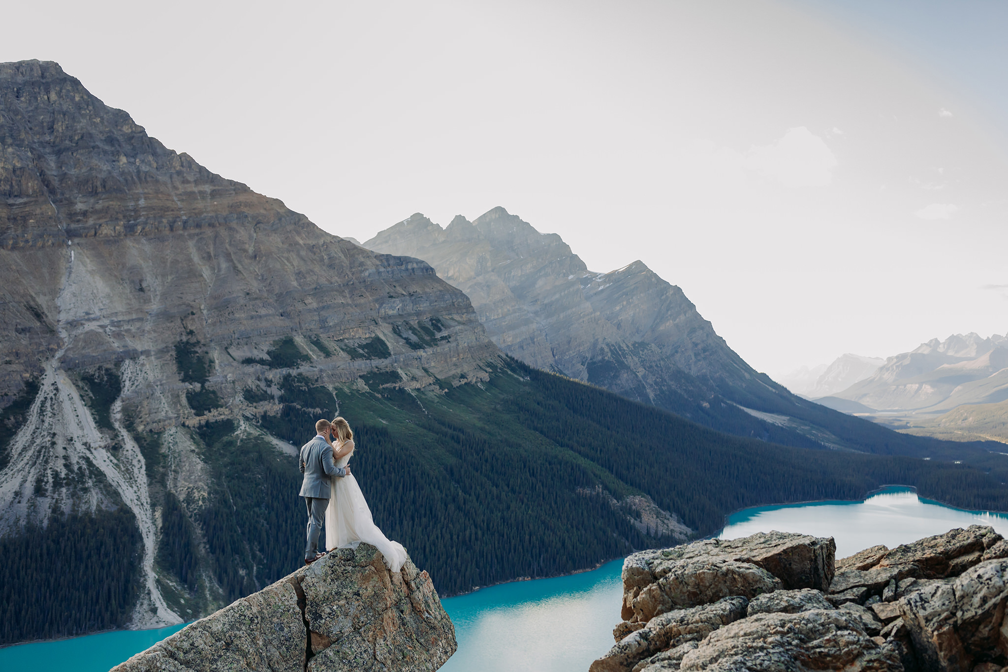 Adventuring in Banff National Park on their wedding day. Summer mountain elopement at Peyto Lake photographed by local wedding & elopement photographer ENV Photography 