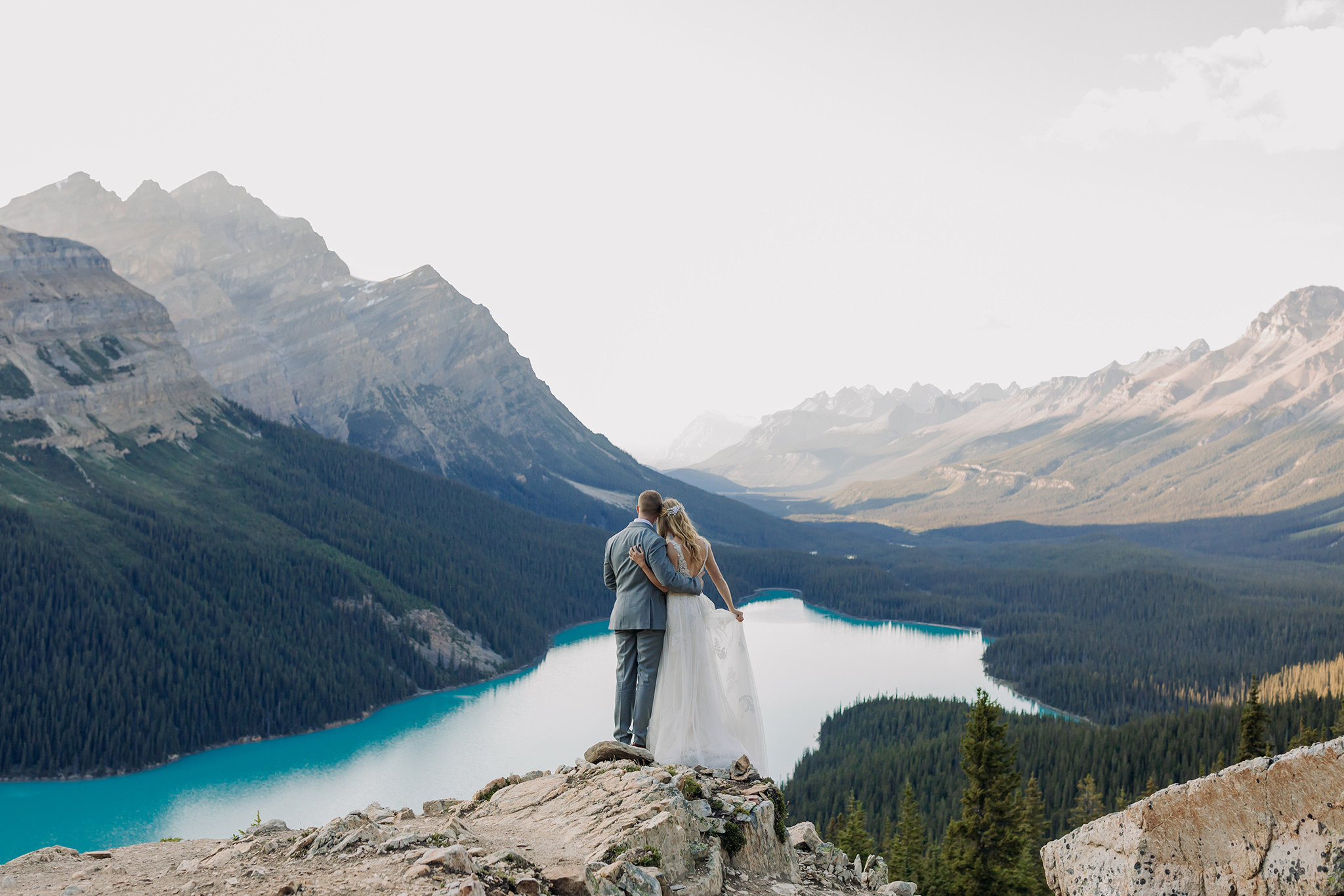 Adventuring in Banff National Park on their wedding day. Summer mountain elopement at Peyto Lake photographed by local wedding & elopement photographer ENV Photography 