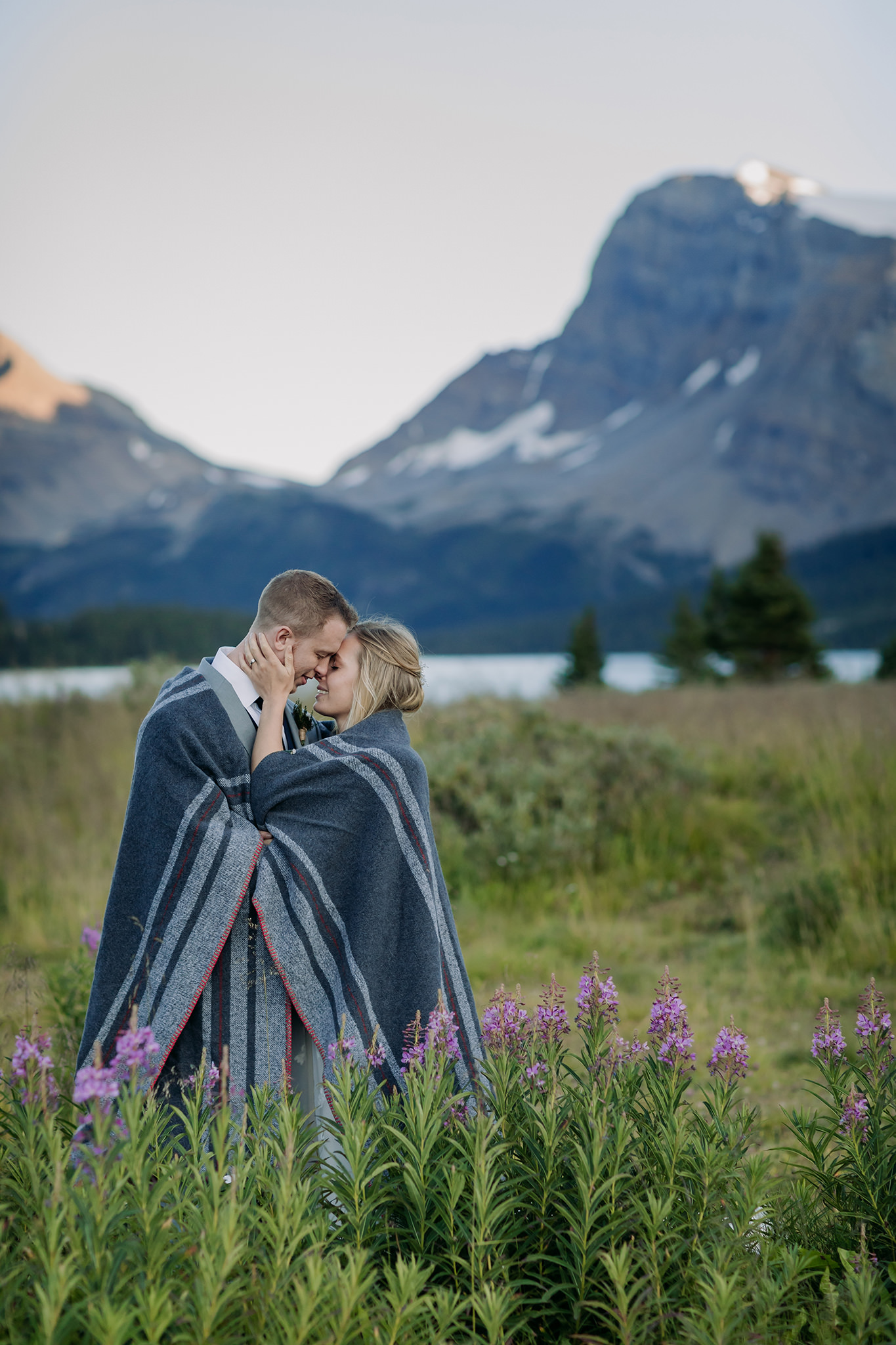 Exploring Icefields Parkway in Banff National Park on their wedding day. Summer mountain elopement at Bow Lake photographed by local wedding & elopement photographer ENV Photography 