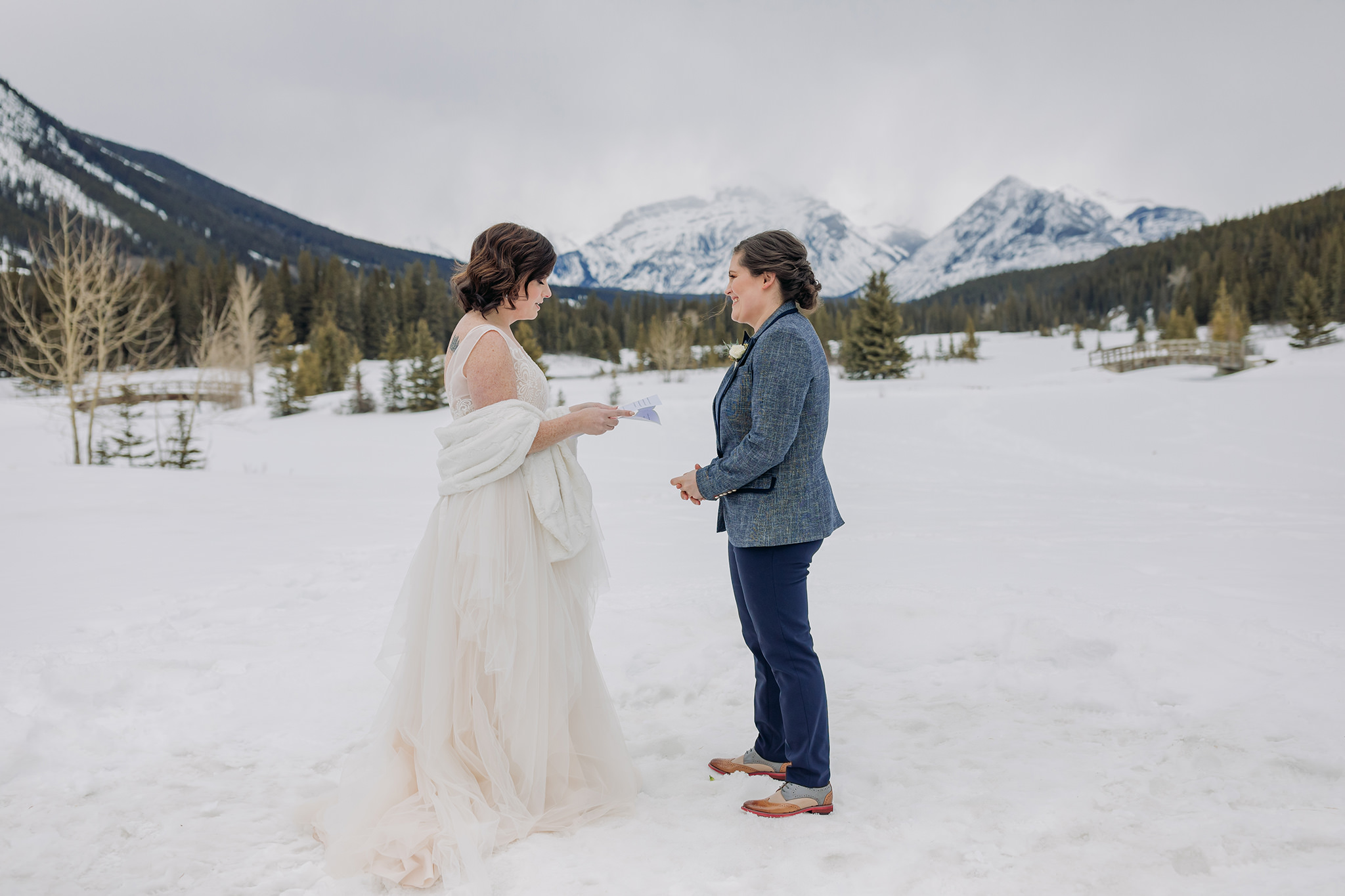 banff intimate same-sex gay wedding ceremony outside at cascade ponds in winter