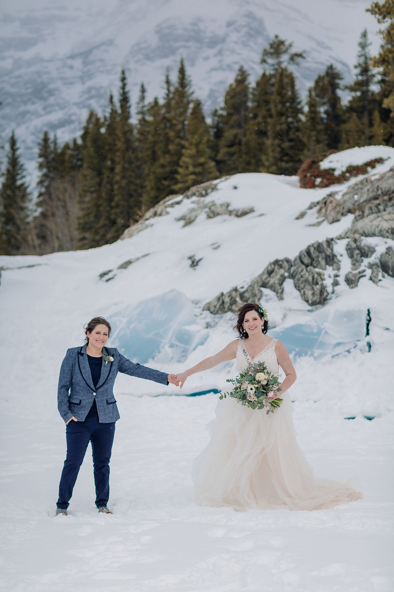 LGBTQ gay elopement in the mountains in winter lake minnewanka