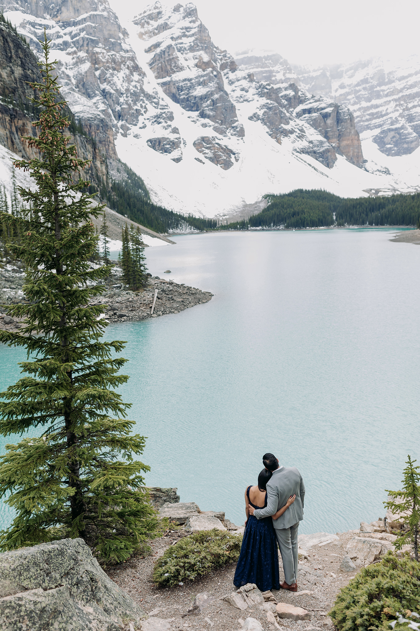 Moraine Lake Stormy Engagement on the rock pile with a formal style