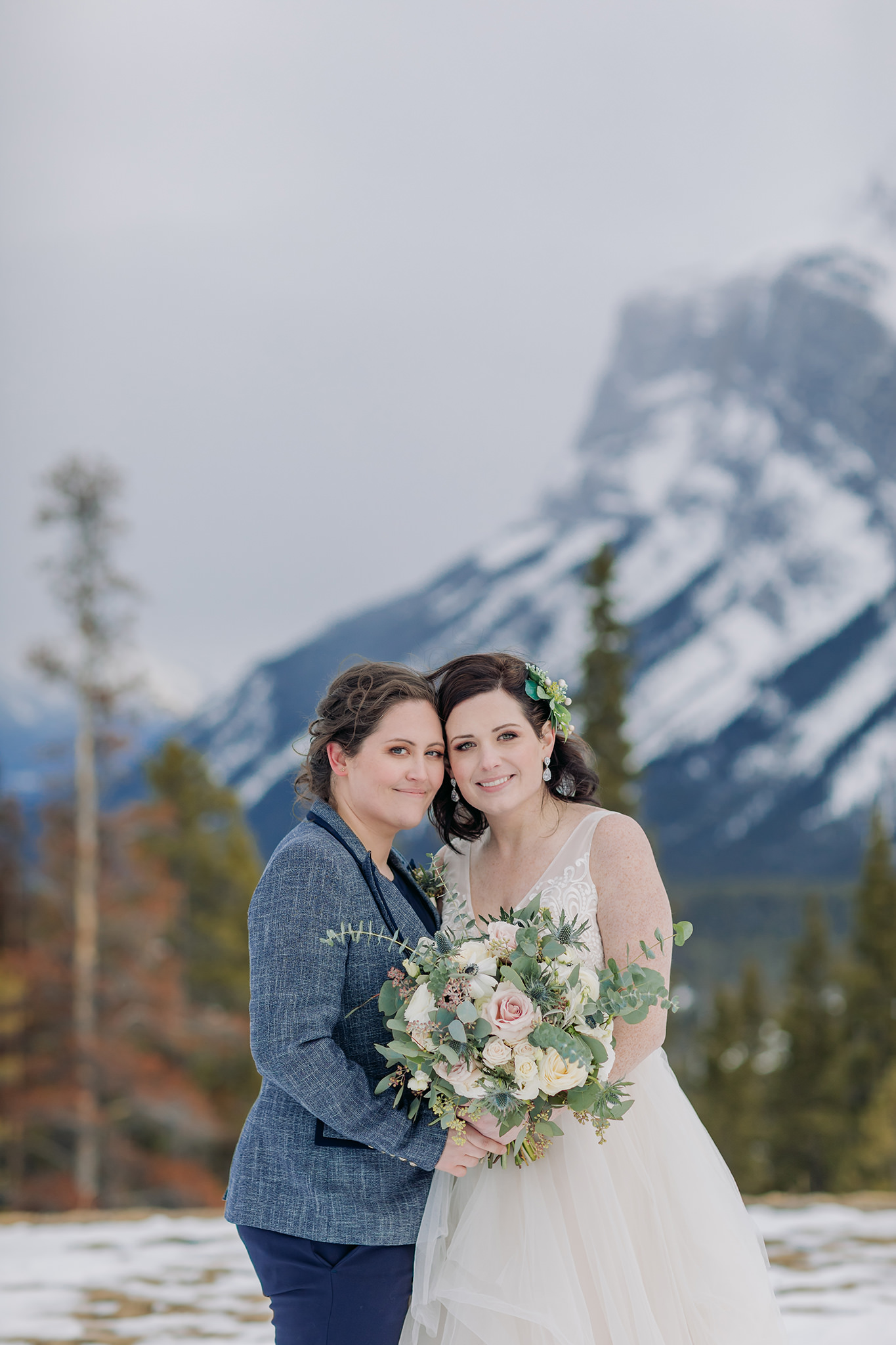LGBTQ gay elopement in the mountains in winter tunnel mountain