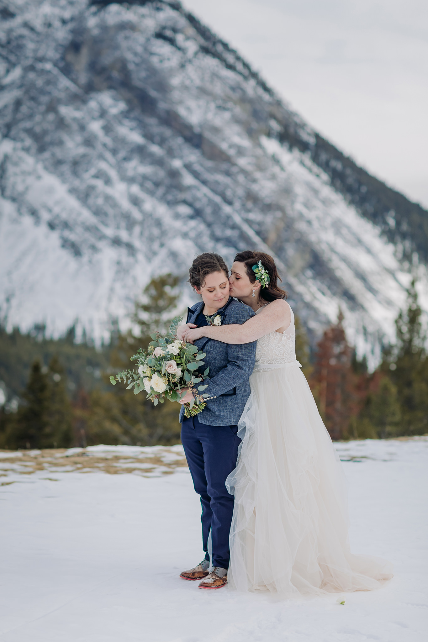 LGBTQ gay elopement in the mountains in winter tunnel mountain