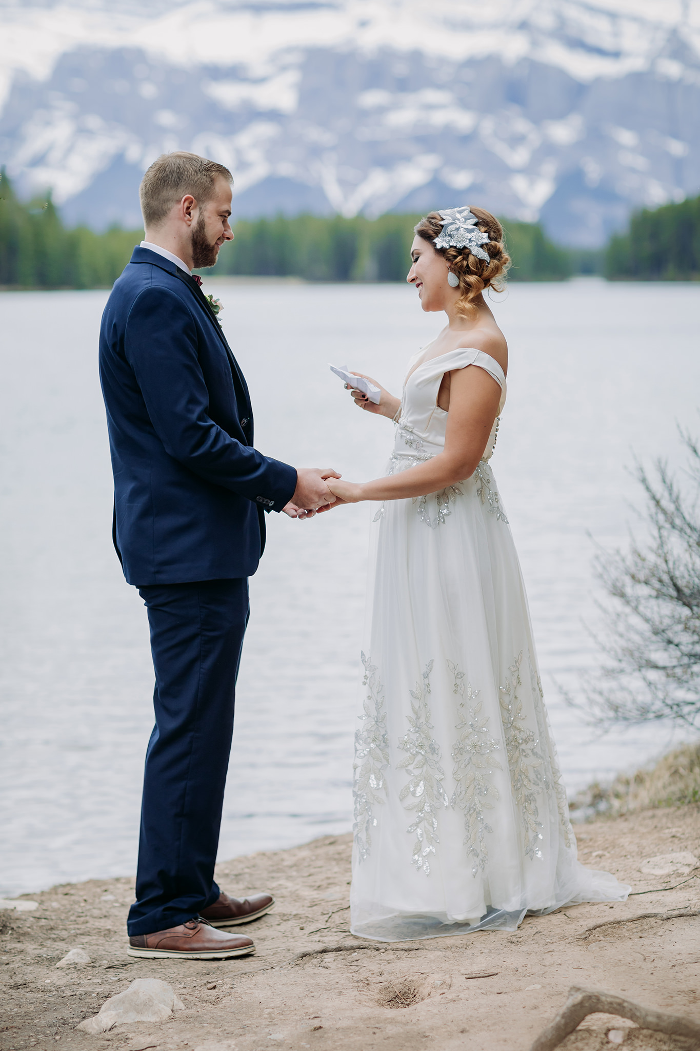 Two Jack Lake elopement wedding ceremony in the spring in the mountains in Banff National Park