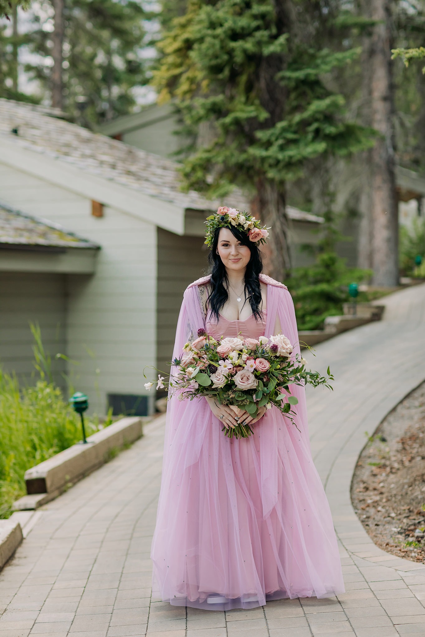 bride leaving cabin to go to ceremony at mountain wedding