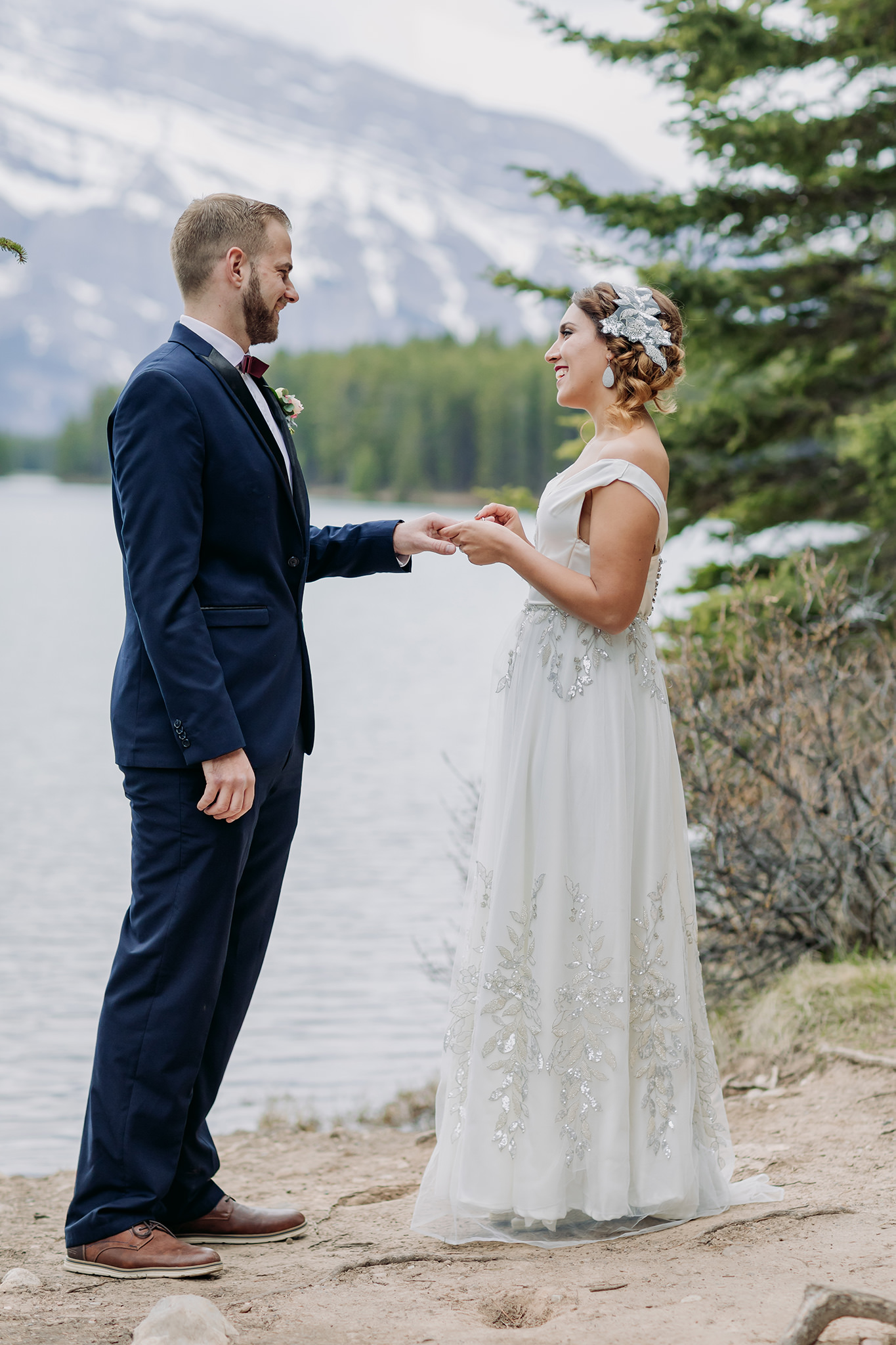 Two Jack Lake elopement wedding ceremony in the spring in the mountains in Banff National Park