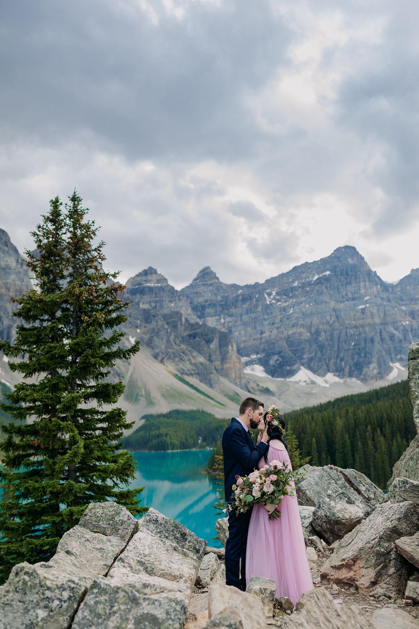Moraine Lake Lodge elopement in the Canadian Rocky Mountains with boho bride in pink
