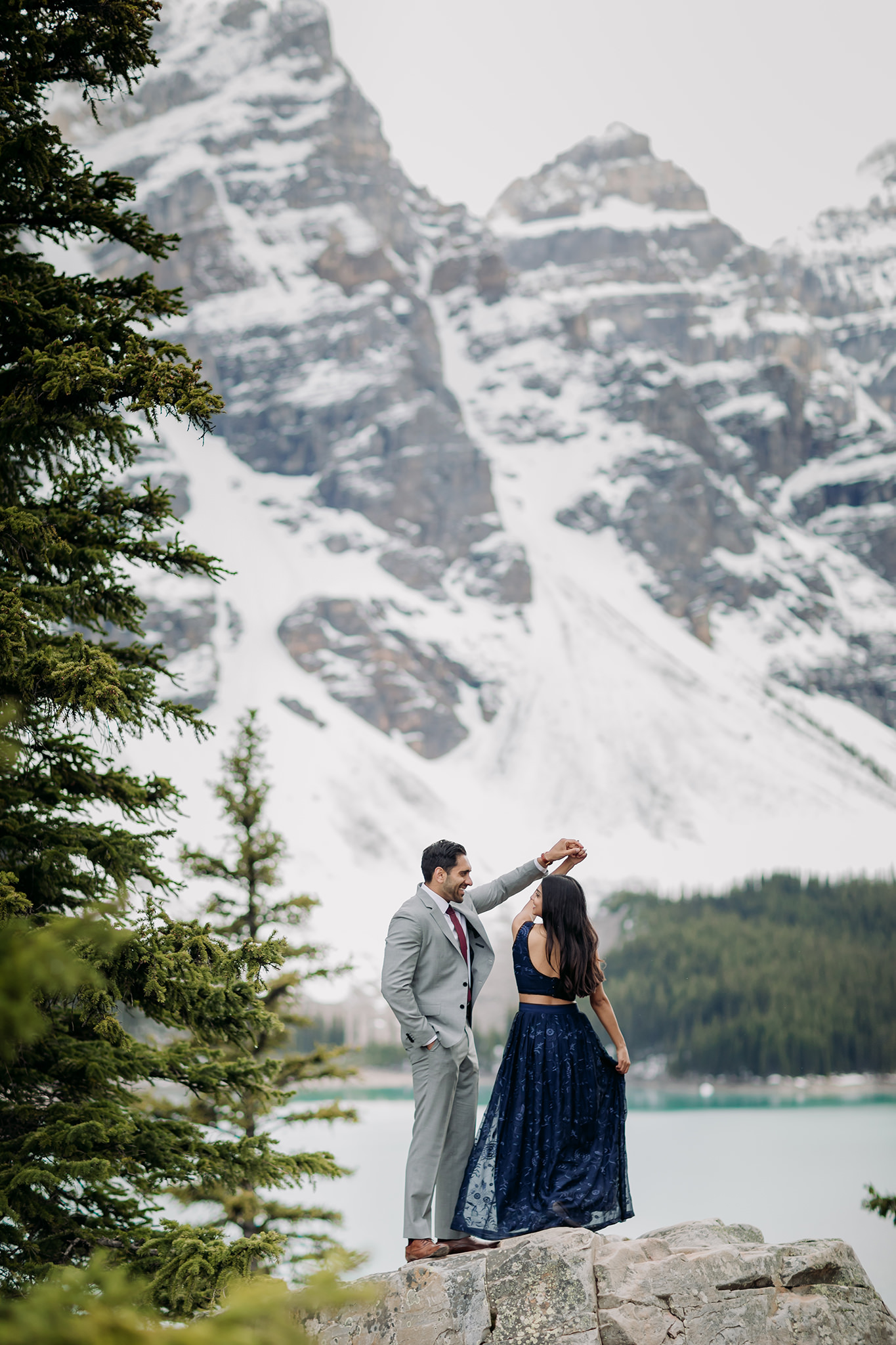 Moraine Lake Stormy Engagement with snow capped mountains