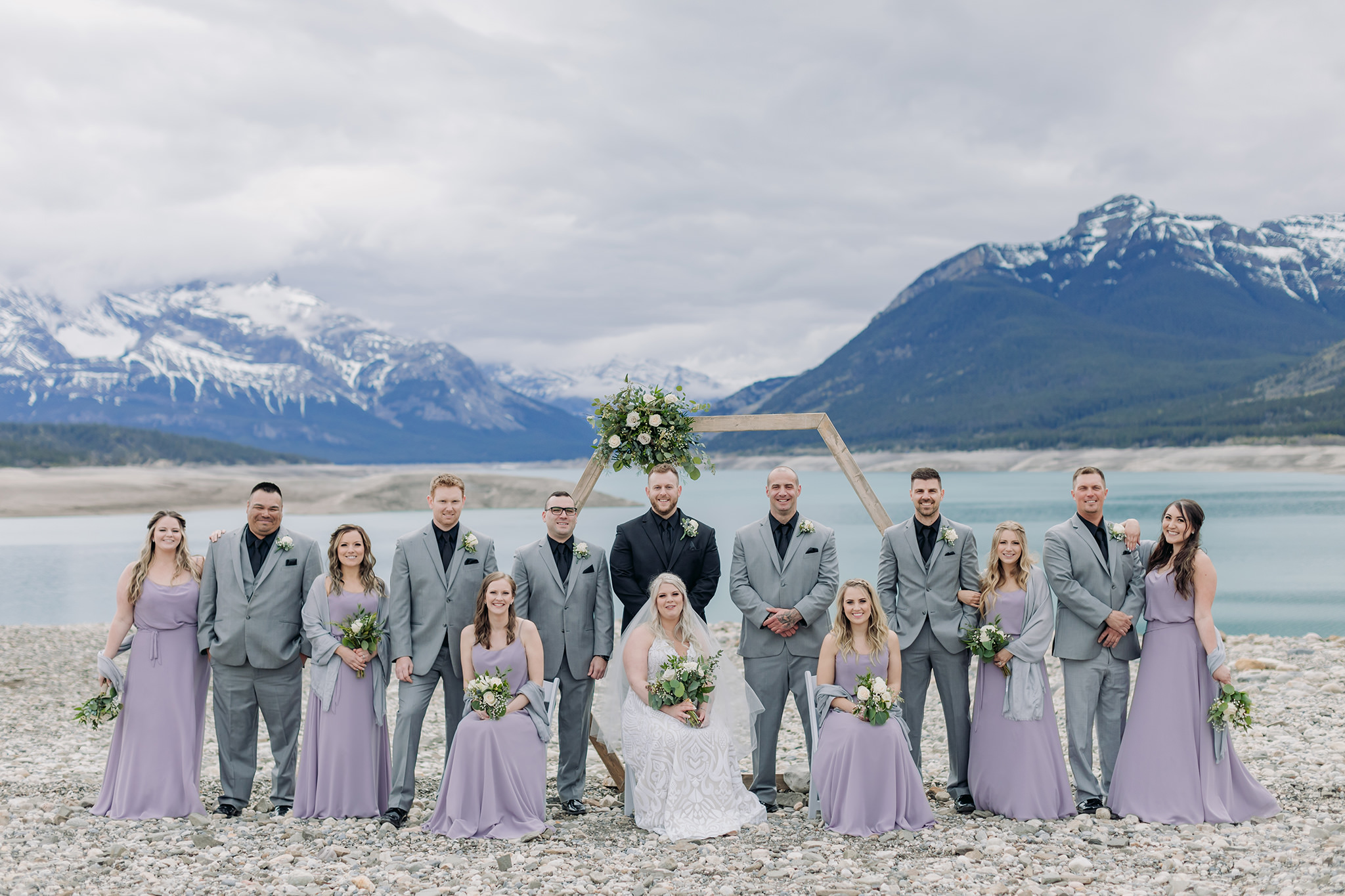 Abraham Lake Spring Mountain wedding with outdoor wedding portraits blue waters & mountains in the distance bridal party portraits