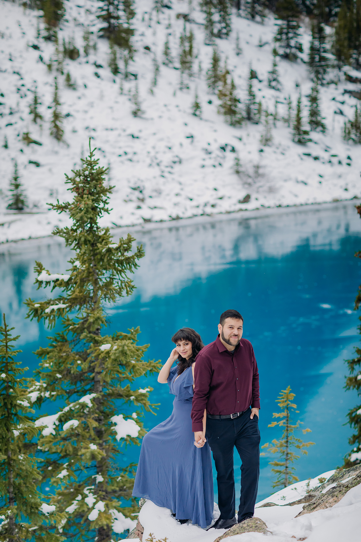 Moraine Lake in October: Freshly frozen mountain lake with blue ice makes stunning backdrop for engagement photos