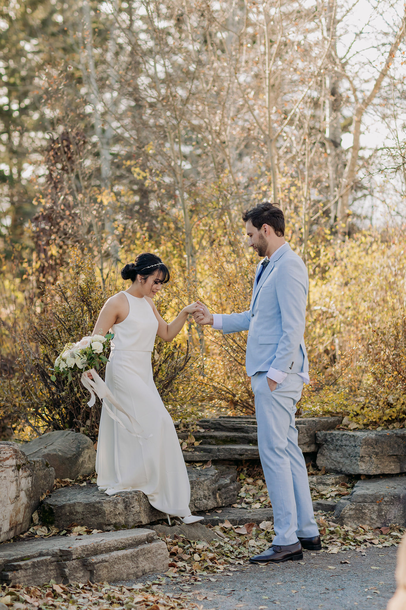 bride & groom portraits on the grounds of Bow Valley Ranche on a sunny October day