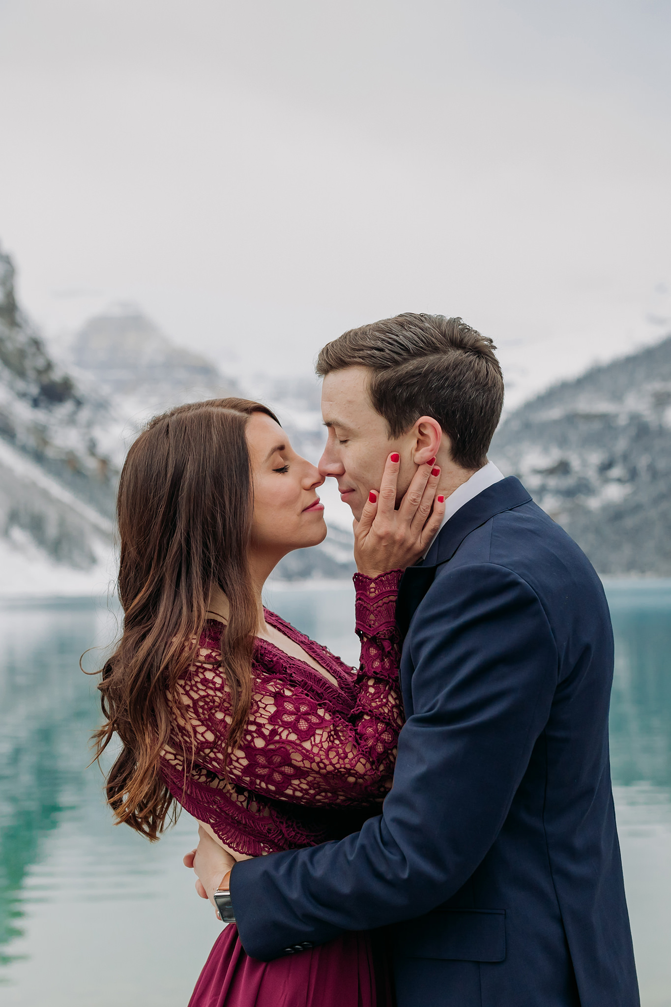 Lake Louise in October Magical SNowy formal mountain engagement photography session