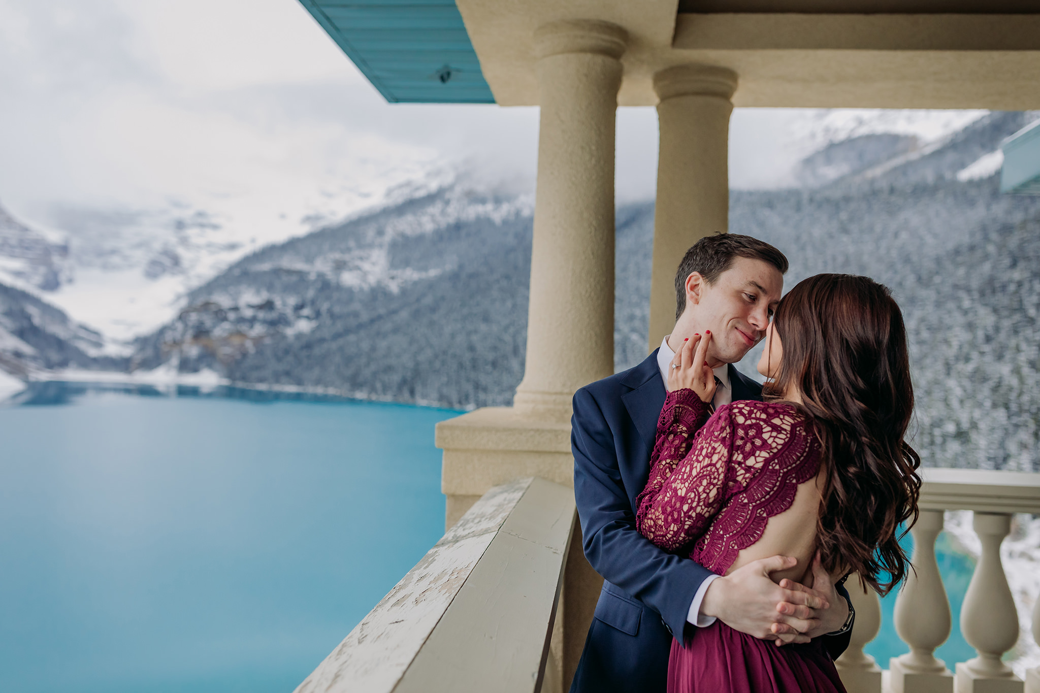 Lake Louise in October Magical SNowy formal mountain engagement photography session in the Belvedere Suite at Fairmont Chateau Lake Louise