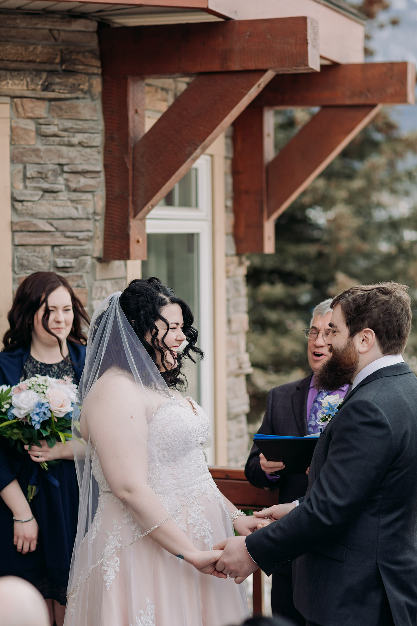 Falcon Crest Lodge wedding Canmore winter wedding ceremony outdoors terrace