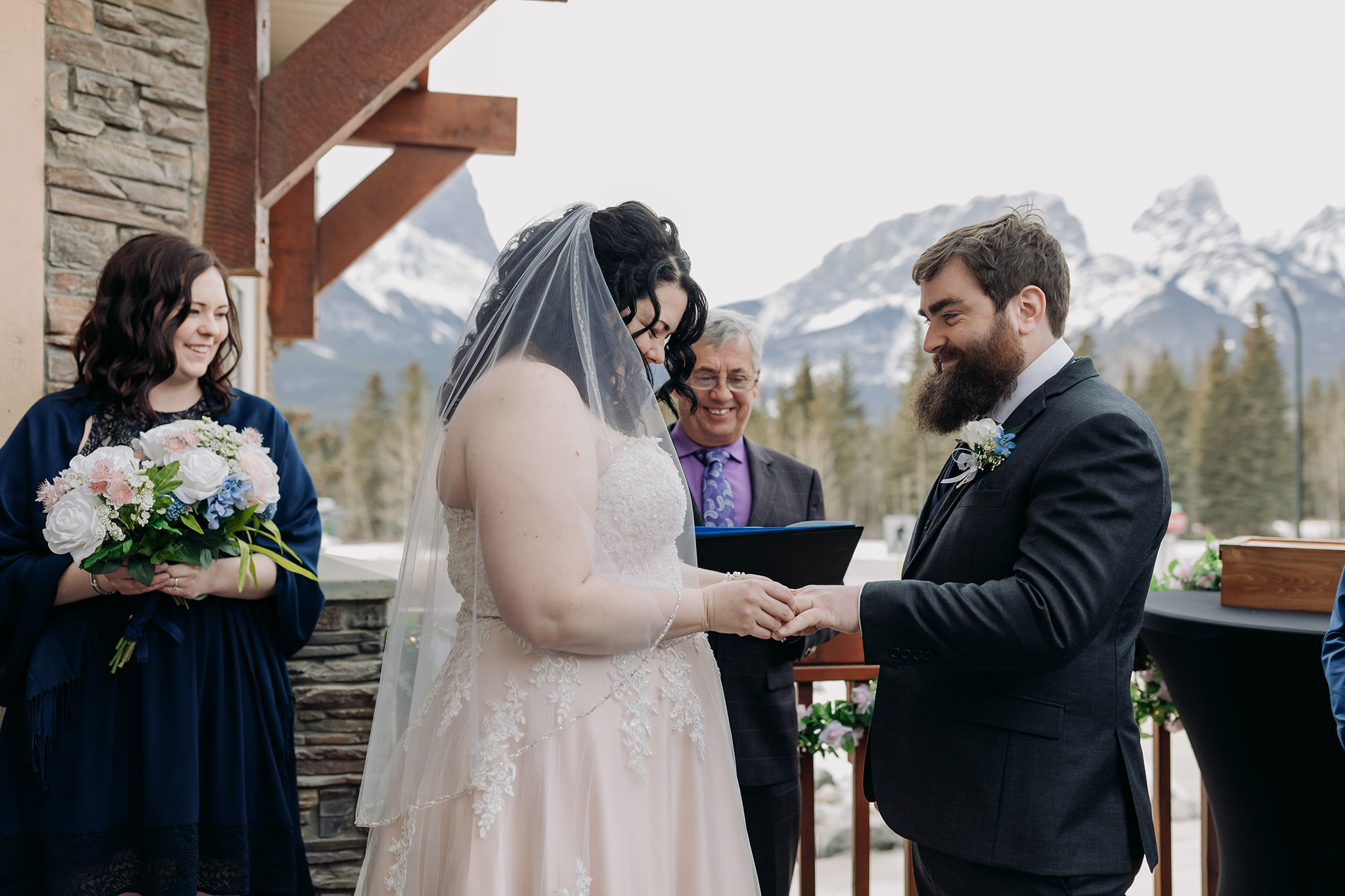 Falcon Crest Lodge wedding Canmore winter wedding ceremony outdoors terrace