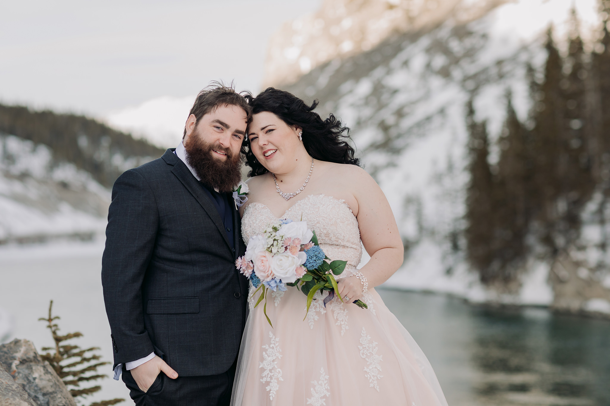  Canmore winter wedding photos bride & groom at Goat Pond in Kananaskis photographed by ENV Photography