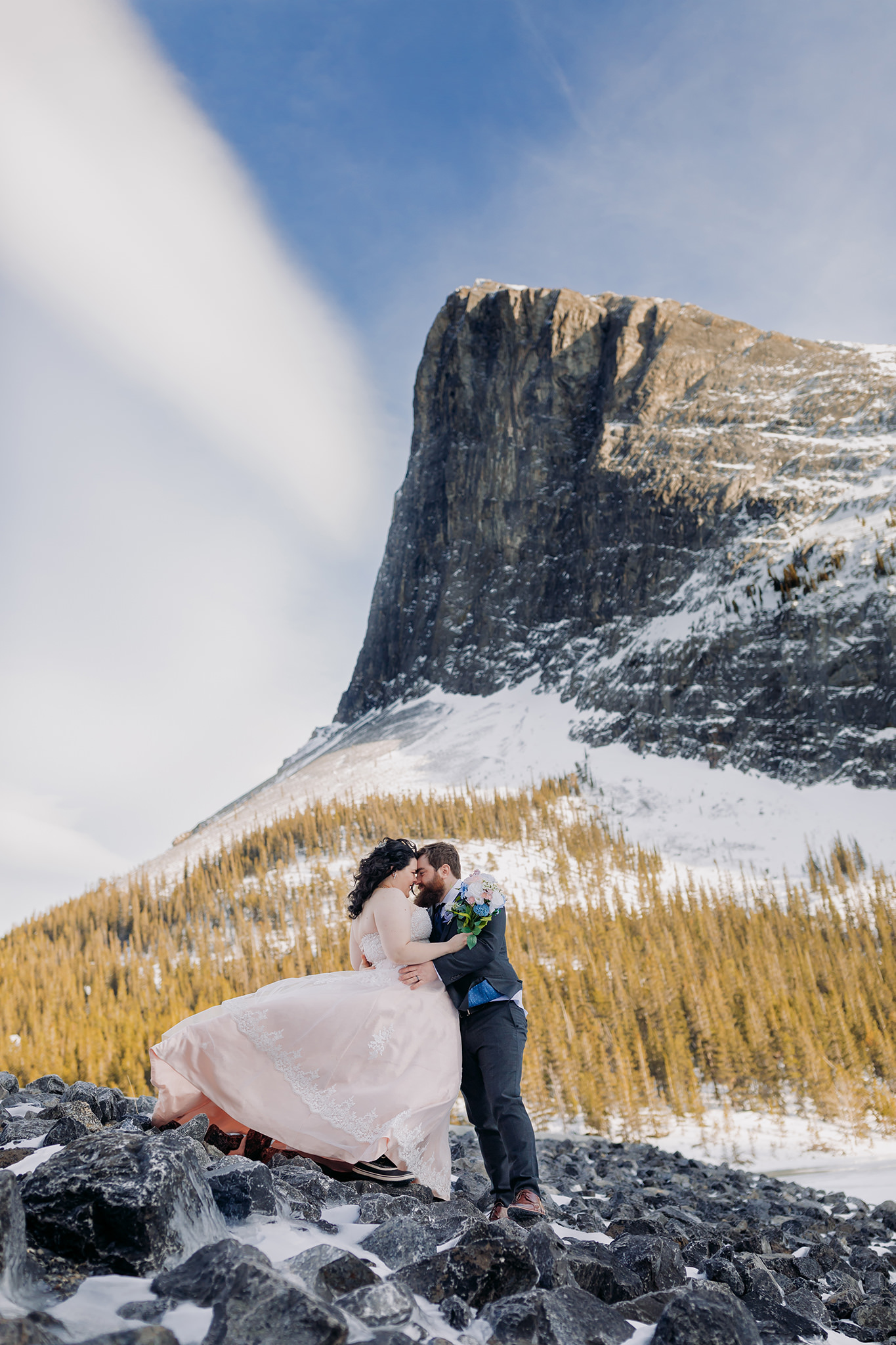  Canmore winter wedding photos bride & groom at Goat Pond in Kananaskis photographed by ENV Photography Ha Ling Peak