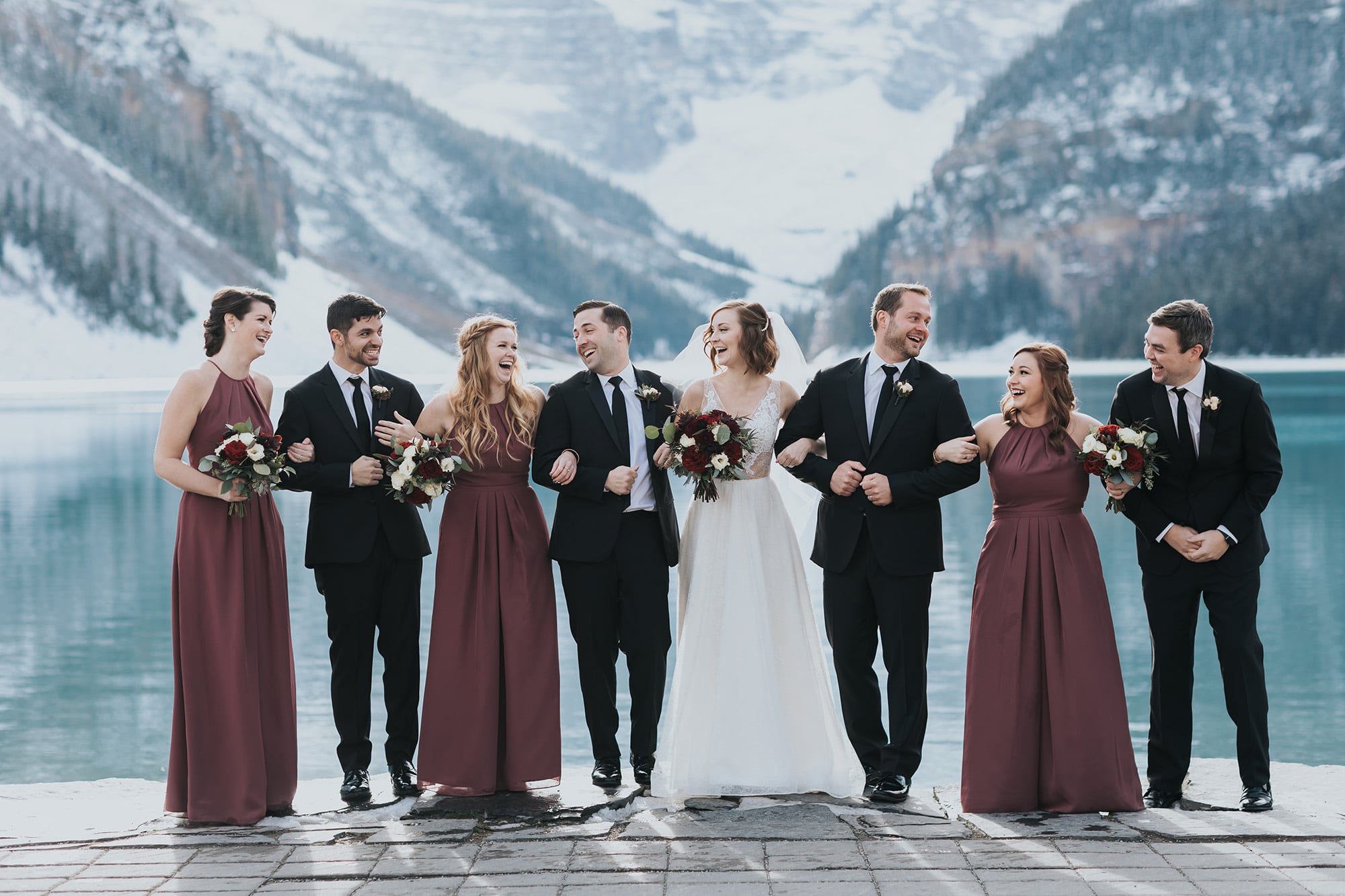 wedding party laughing during outdoor mountain wedding