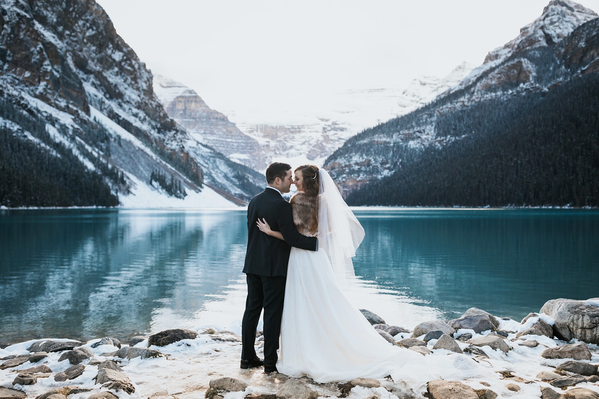 Late October wedding at Lake Louise with snow on the ground & blue water