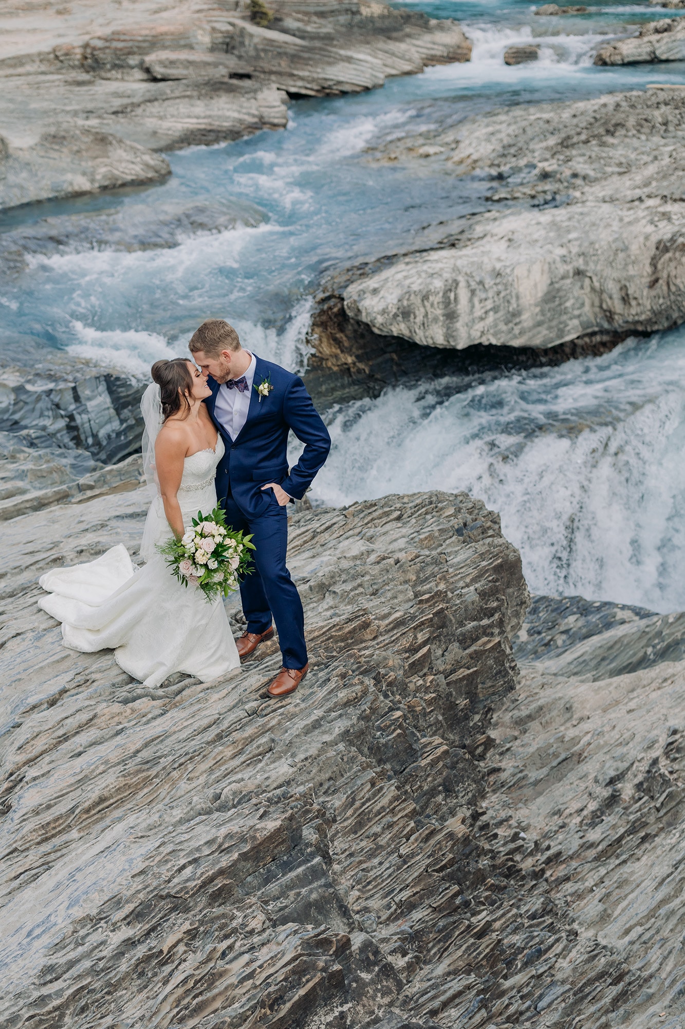 mountain eleopement emerald lake lodge bride groom photos natural bridge