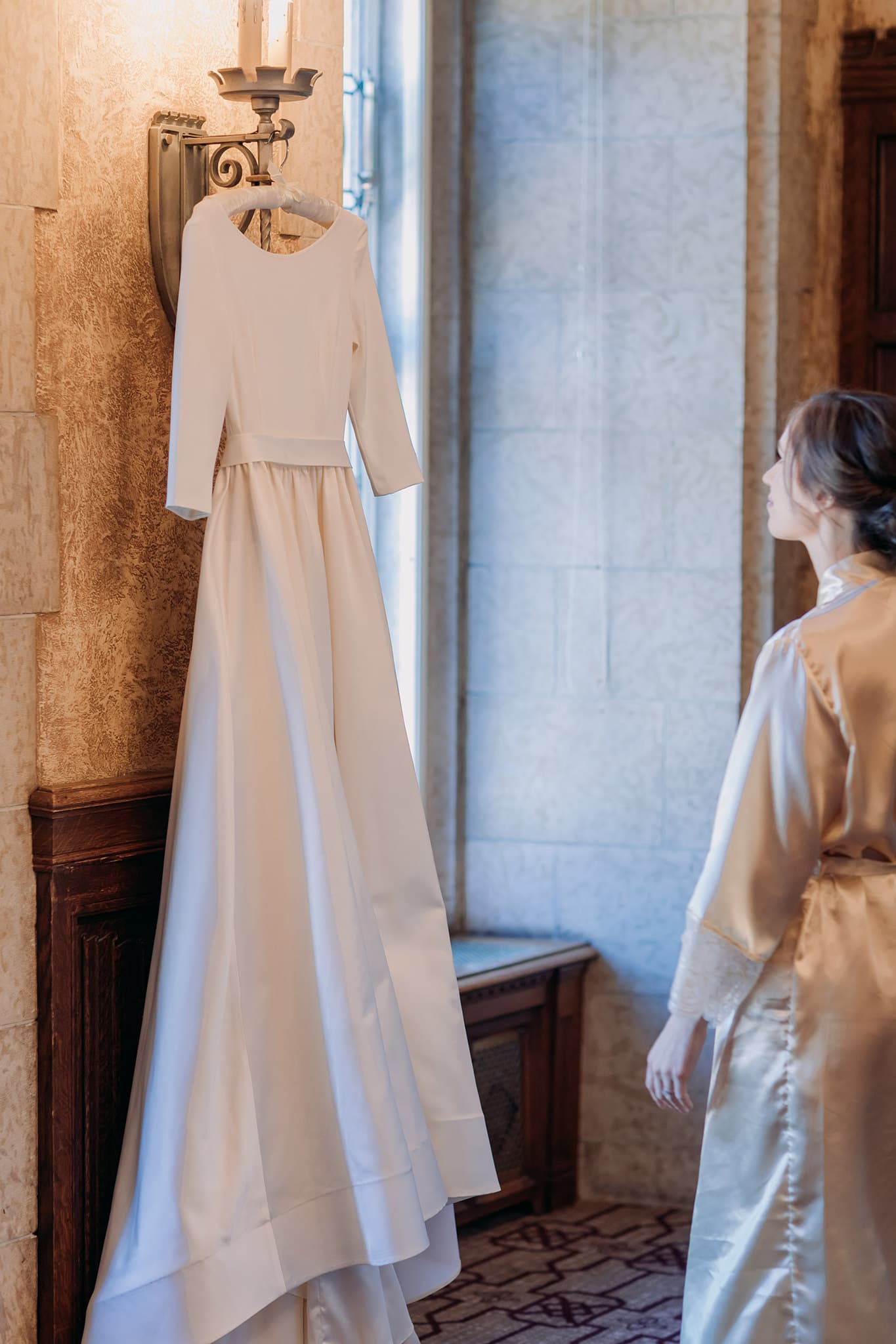 bride looking at Chantelle Lauren Designs wedding gown