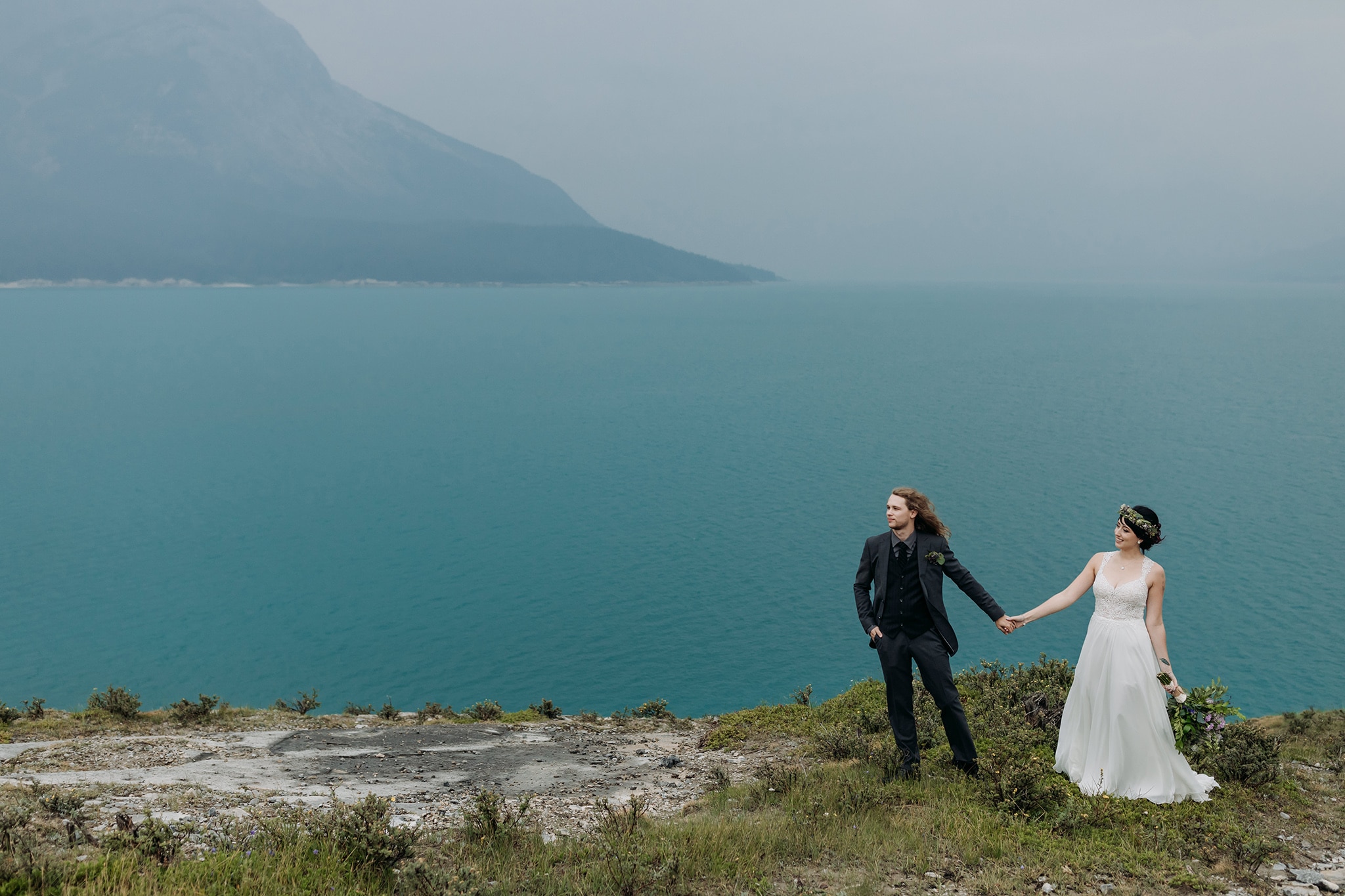 A Guide to Eloping in the Canadian Rockies | Mountain Wedding photographed by ENV Photography | stormy mountains wedding at Abraham Lake | Boho wedding