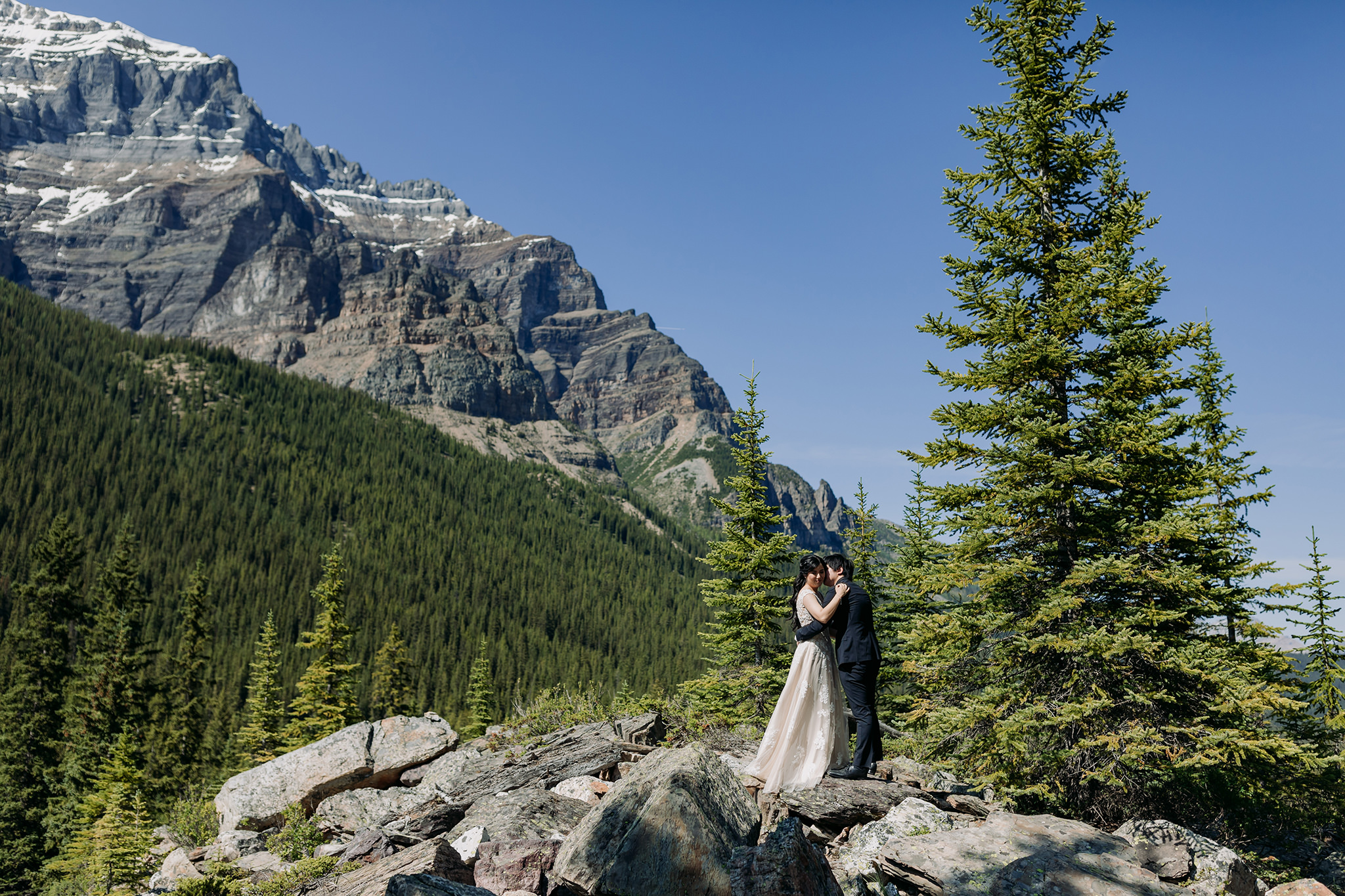 bride groom portraits at Moraine Lake on bright sunny day in Banff National Park photographed by mountain elopement specialist ENV PhotographyENV Photography