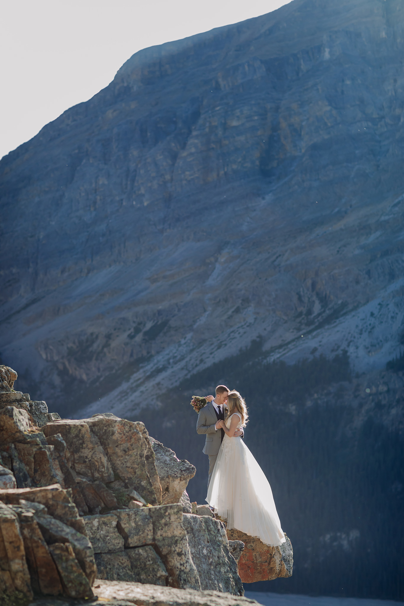 Adventuring in Banff National Park on their wedding day. Summer mountain elopement at Peyto Lake photographed by local wedding & elopement photographer ENV Photography
