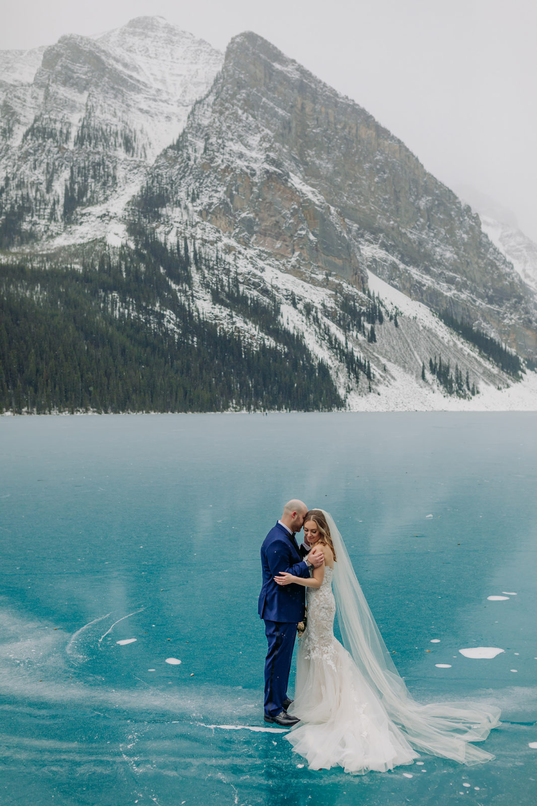 Epic Blue Ice winter wedding at Fairmont Chateau Lake Louise mountains