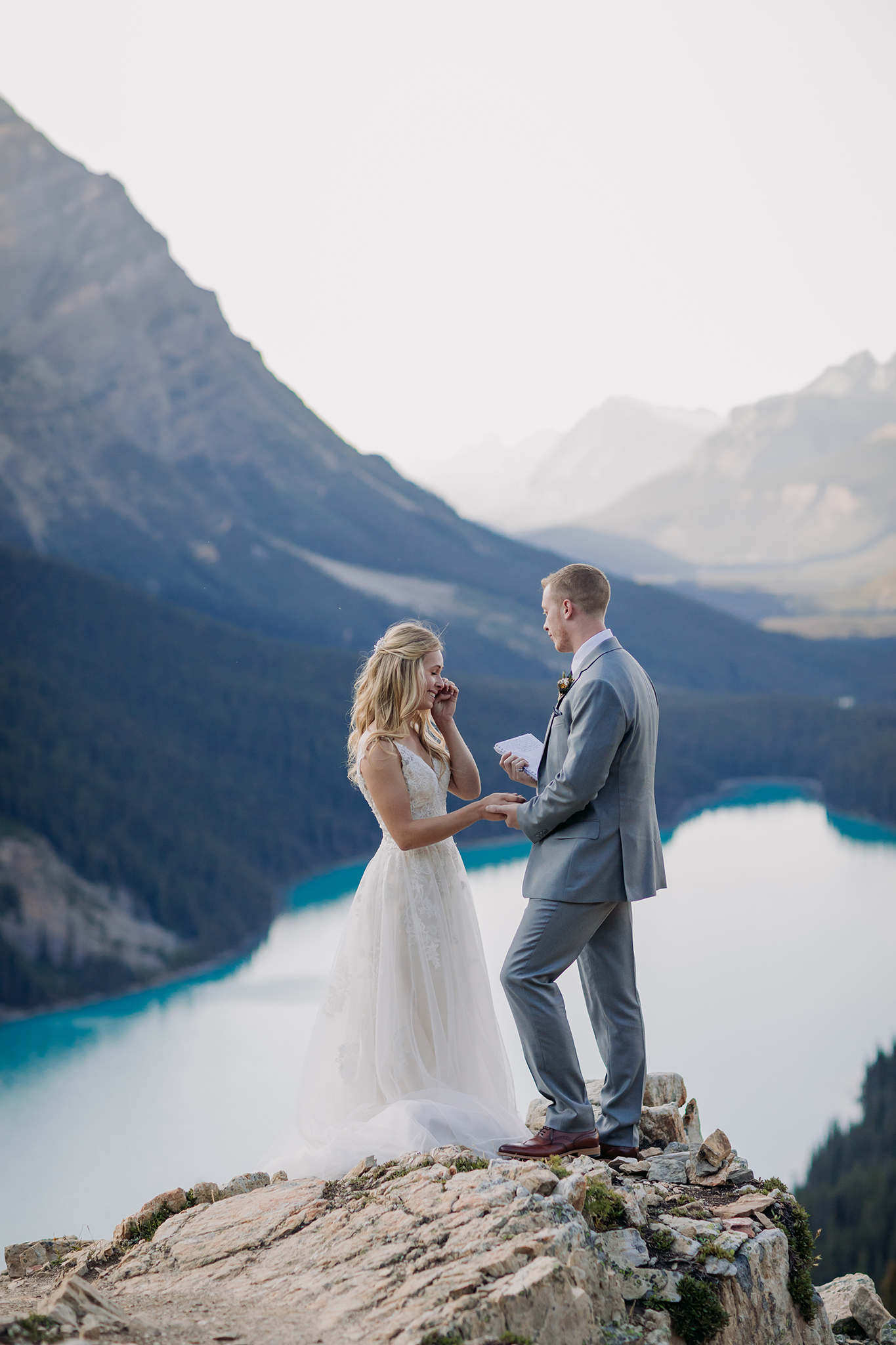 How to Get Married in 2020: Elope Now & Party Later! Peyto Lake elopement reading vows on mountaintop
